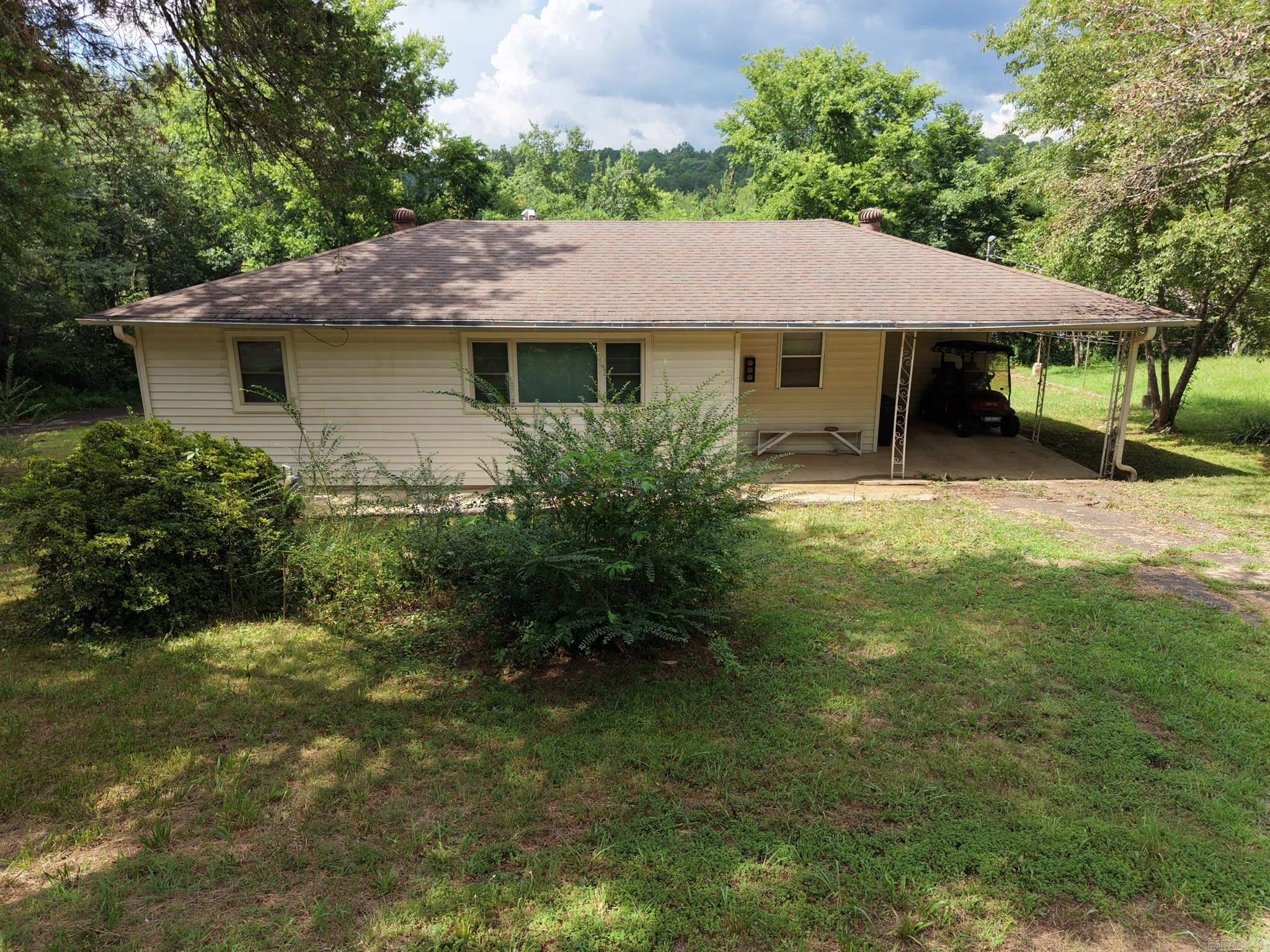Looking for an affordable home with character, solid construction, and room to make it your own? This charming 3-bedroom, 1-bath home at 192 Oakdale Circle in Clinton, Arkansas offers 1,040 square feet of comfortable living on a 0.5-acre lot tucked away on a quiet dead-end street.  Filled with nostalgia, this home has stood the test of time with great bones, beautiful hardwood floors, and central heat and air. Preserve its timeless charm or bring your own vision and updates to create the home you've always wanted.  Outside, you'll find plenty of space for a garden, outdoor entertaining, or simply enjoying the peaceful setting. The attached carport provides convenient covered parking, and the location puts you just minutes from downtown Clinton, shopping, restaurants, and the city known as the home of the National Championship Chuckwagon Races.  Whether you're a first-time homebuyer, downsizing, or searching for an investment opportunity, this property is full of potential at an affordable price.