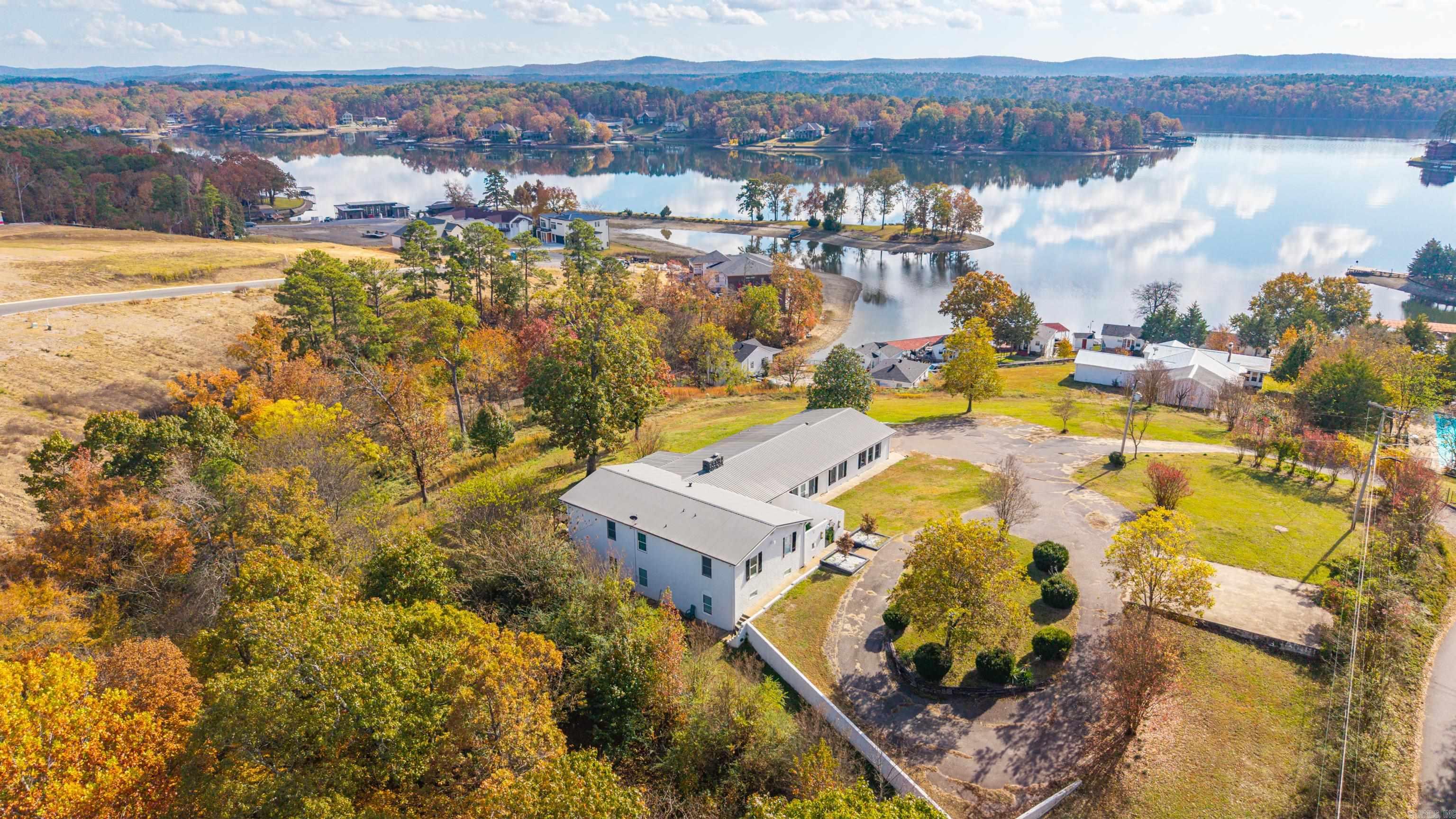 Listed below appraised value! Stunning Spanish inspired lakefront property on Lake Hamilton, complete with a transferrable STR license. Perfectly positioned in central Hot Springs, just minutes from the city's top attractions. This home offers gorgeous lake views, generous living spaces unique architectural charm, and 1.7 acres (MOL) of land. An exceptional opportunity! Call today to schedule your showing!