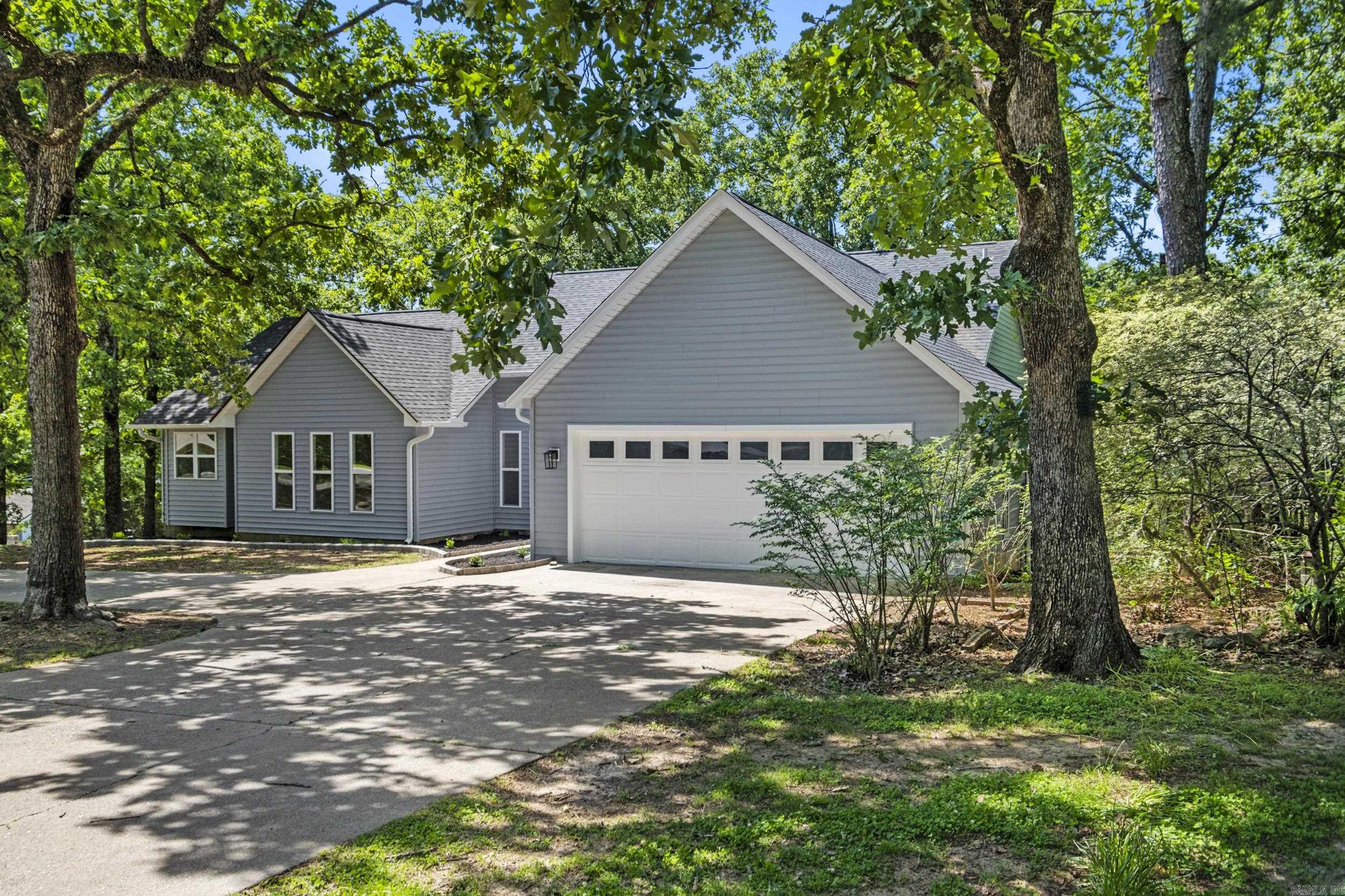 Totally remodeled and like new. Sitting on a beautiful, tree covered, 1 acre lot right in the heart of Cabot. Great location with easy access to shopping and freeway in just minutes. New flooring, light fixtures, plumbing fixtures, HVAC, Water Heater, Roof, cabinets, SS appliances, LVP flooring, windows and doors, trim...and more, all new! Kitchen features quartz counters, wall convection oven, lazy susan cabinets. Cabinets have soft close door and drawers. Two private decks that overlook the huge yard. The garage will fit even the biggest SUV or truck with room to spare. Master bath has a twin sink vanity and a big walk in tile shower. Master bedroom has a door that leads to its own private deck. Come check this one out today.  AGENTS: SEE REMARKS