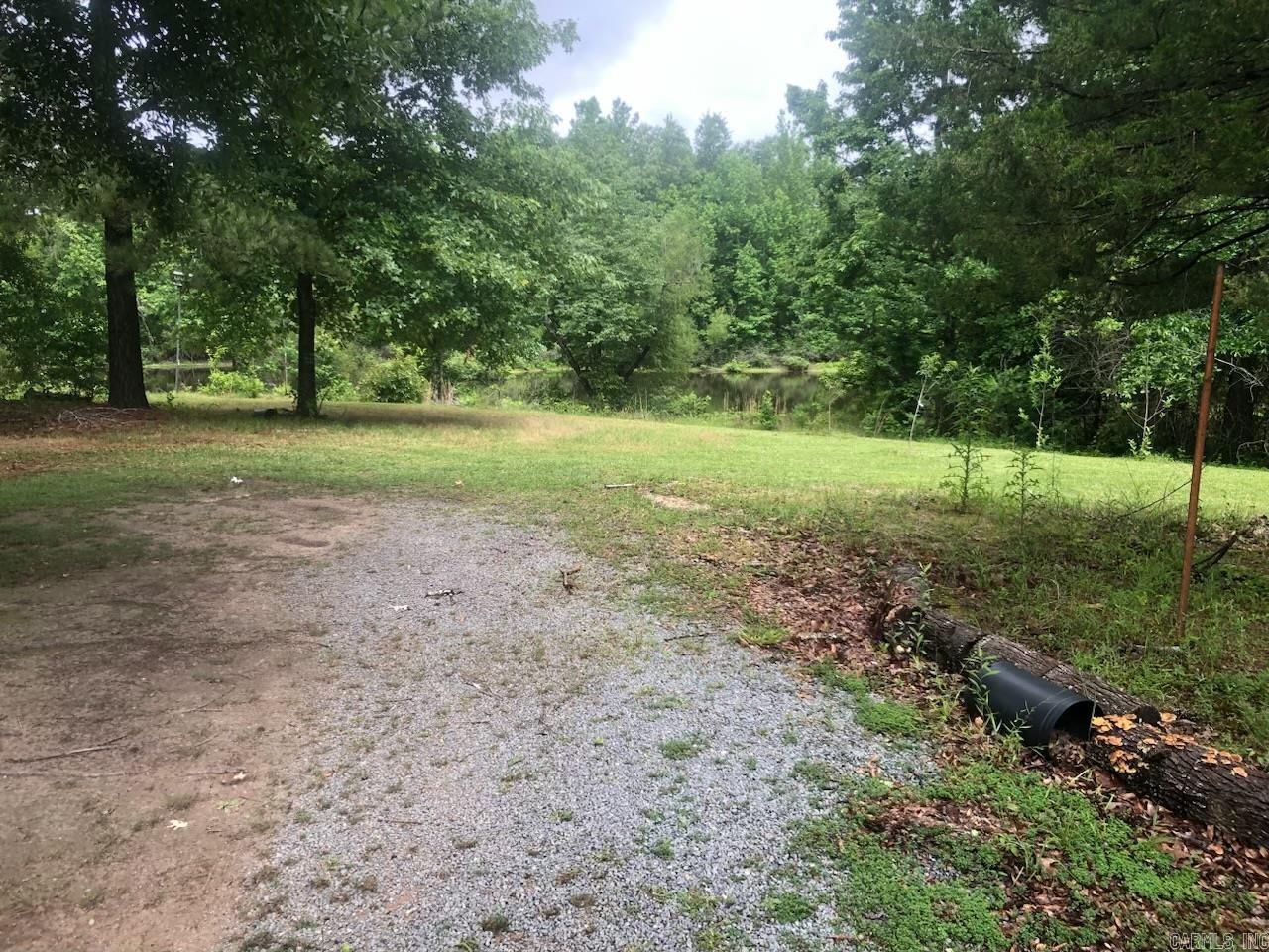 Extremely well built home designed for easy living on appx 10.0 acers.  Garden site, fruit trees and a stocked 2 acre pond.  Hardwood timber perfect for deer hunting or a weekend get-a-way.