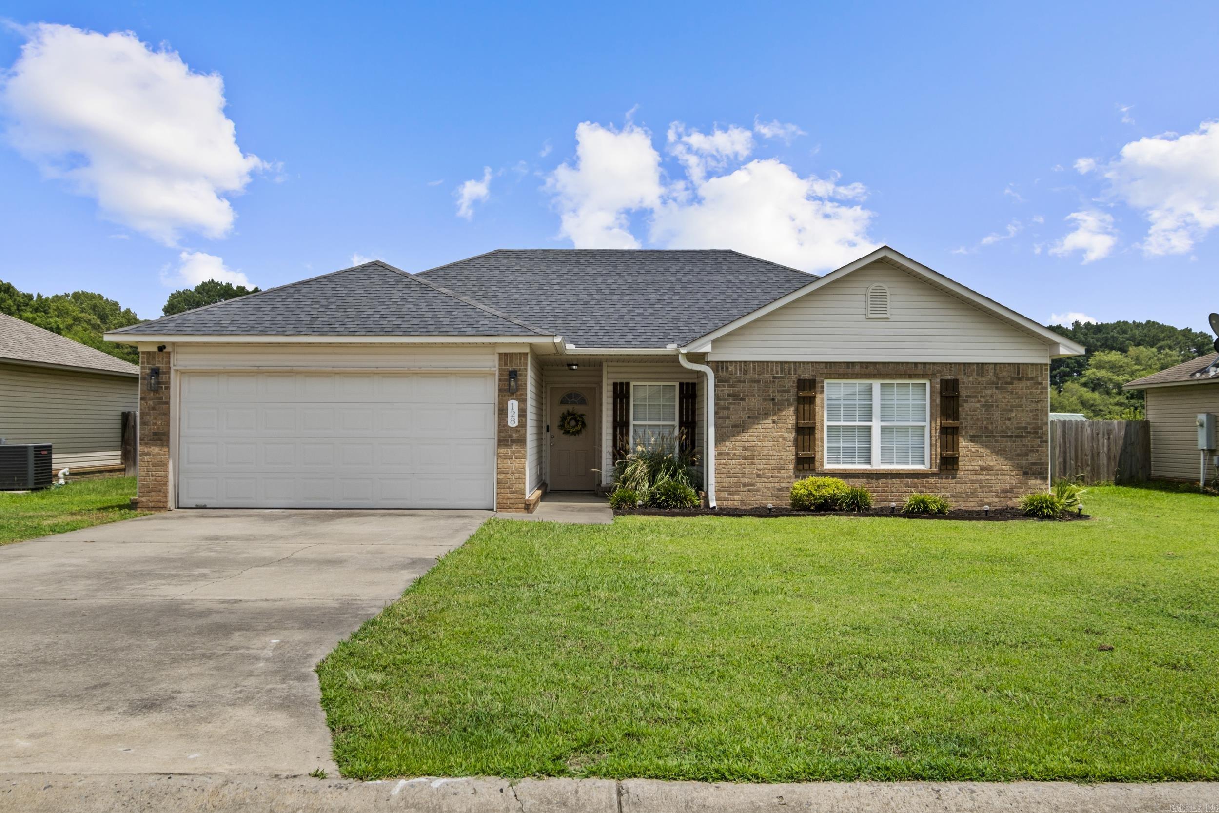 MOVE IN READY!!!! Welcome to 128 Angel Lane, where all the big-ticket items have already been taken care of. This beautiful 3-bedroom, 2-bath home features a new roof (2023), new outdoor A/C unit (2024), new water heater (2026), brand-new flooring and baseboards (2026), plus two stunningly remodeled bathrooms. The primary suite boasts a completely renovated bath with new tile, tub, vanity, and plumbing fixtures, while the guest bath has also been beautifully updated with new tile, tub, enclosure, and fixtures. Enjoy modern updates without the hassle of renovation. Located in a desirable Beebe neighborhood, this home is ready for you to move right in!