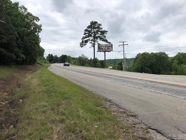 Great Highway frontage across the hwy from Bridal Fails, and just down the hill from Red River Dodge, wooded property with a view!!!!!  Would make a great estate or could be used for commercial purposes, business or pleasure this property has it all. MINERAL RIGHTS DO NOT CONVEY.  Great location