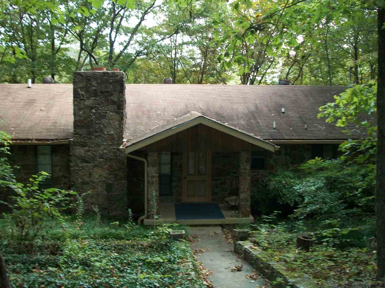 This amazing one of a kind home has many unique features. Being the last house on the street, this is a very secluded lake house. A wooden walk way all the way to a 3 Stall dock with a pontoon and a lift. Sits on 8.27 acres and can purchased with an additional 8.27 acres. A very neat gazebo where you can enjoy your morning coffee. You can walk out on a side look out point and watch the water fall. The house comes furnished. 31x32 detached garage for all your lake toys. See agent remarks.