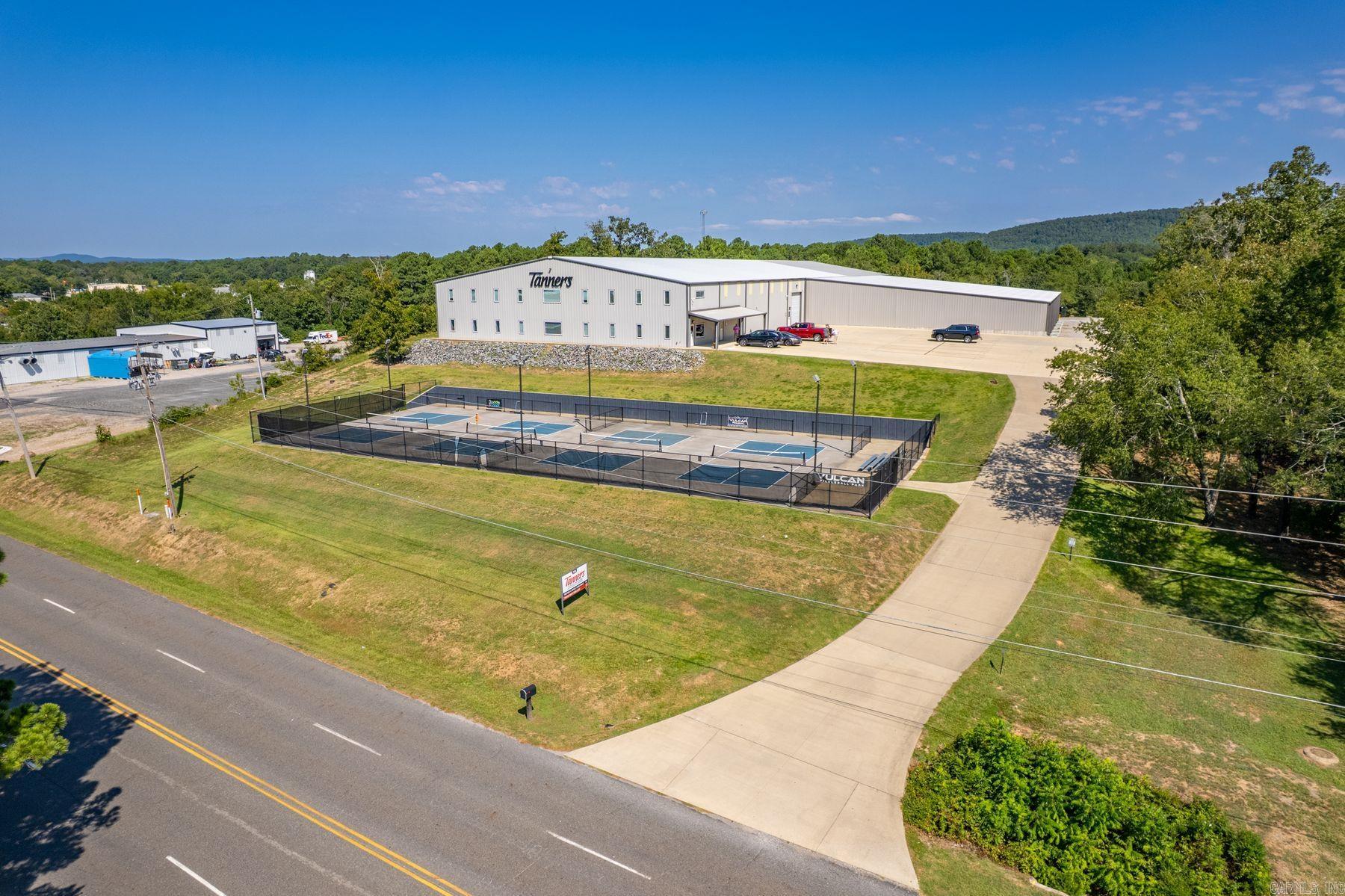 This impressive 47,500 SF industrial warehouse offers an ideal combination of functionality and modern office accommodations. The building features 42,500 square feet of clear-span space, including 5,000 square feet of heated and cooled office space designed for comfort and efficiency. The warehouse is built with 18-foot side walls and a 25-foot center under beam, giving plenty of vertical clearance for racking, machinery, or distribution needs.  Loading and logistics are streamlined with two 8'x10' loading docks and one 12'x14' drive-thru door, with a separate road entrance and turn-around area for semi and trailer access.  Situated on 6.32 acres, the property provides ample room for future expansion, additional parking, or outdoor storage.   Located in the Mid America Industrial Park this property is perfectly suited for manufacturing, distribution, or logistics operations and delivers the space, infrastructure, and growth potential businesses demand—all in a prime location.