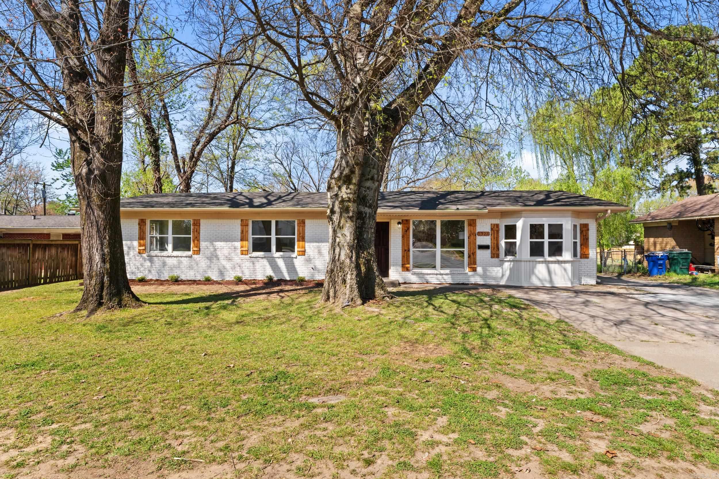 Welcome to 1323 Donaghey, a beautifully updated 4 bedroom, 2.5 bath home offering both style and functionality in a highly convenient location. This property features thoughtful upgrades throughout, including custom cabinetry, granite countertops, new flooring, fresh paint and a gorgeous bay window. This home has been enhanced with the addition of a bathroom, along with a custom shower and updated light fixtures that give the space a modern, elevated feel. Outside, you'll find a fully fenced backyard perfect for relaxing or entertaining, plus the added benefit of both a garage and carport for ample parking and storage. Ideally located near schools, restaurants, and the college. This home offers the perfect blend of comfort, upgrades, and convenience.