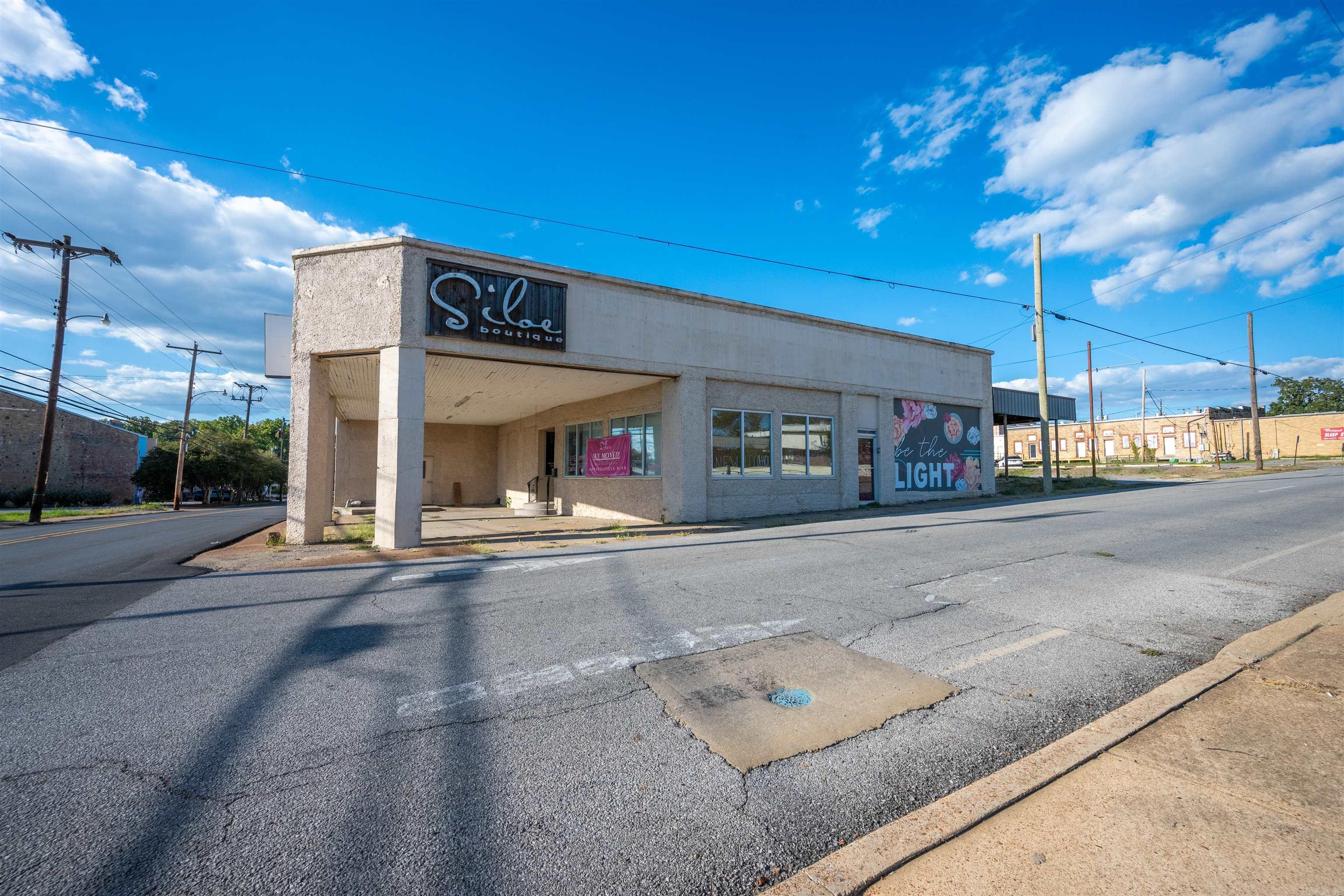 Endless potential in the heart of BATESVILLE'S HISTORIC DISTRICT just steps from MAIN STREET! This est. 9,718 SQ FT commercial building is positioned with prime visibility with a 9,100 DAILY TRAFFIC COUNT per ARDOT. The STOREFRONT is move-in ready with NEWER SPRAY FOAM INSULATION, 5 DRESSING ROOMS, a HALF BATH, OFFICE with an additional HALF BATH, and plumbing for a KITCHEN space. Already conditioned for RESTAURANT USE with a GREASE TRAP, this property can potentially be transformed into RETAIL, DINING, OFFICE, or MULTI-BUSINESS space. Additional areas include OFFICE, another RETAIL SPACE with MEN'S AND WOMEN'S BATHROOMS, and STUDIO space. With THREE COMMERCIAL-SIZED ELECTRICAL PANELS, one full and two open for expansion. It is a BLANK CANVAS, ready for your business plans with Convenience of an ON-SITE PARKING LOT.