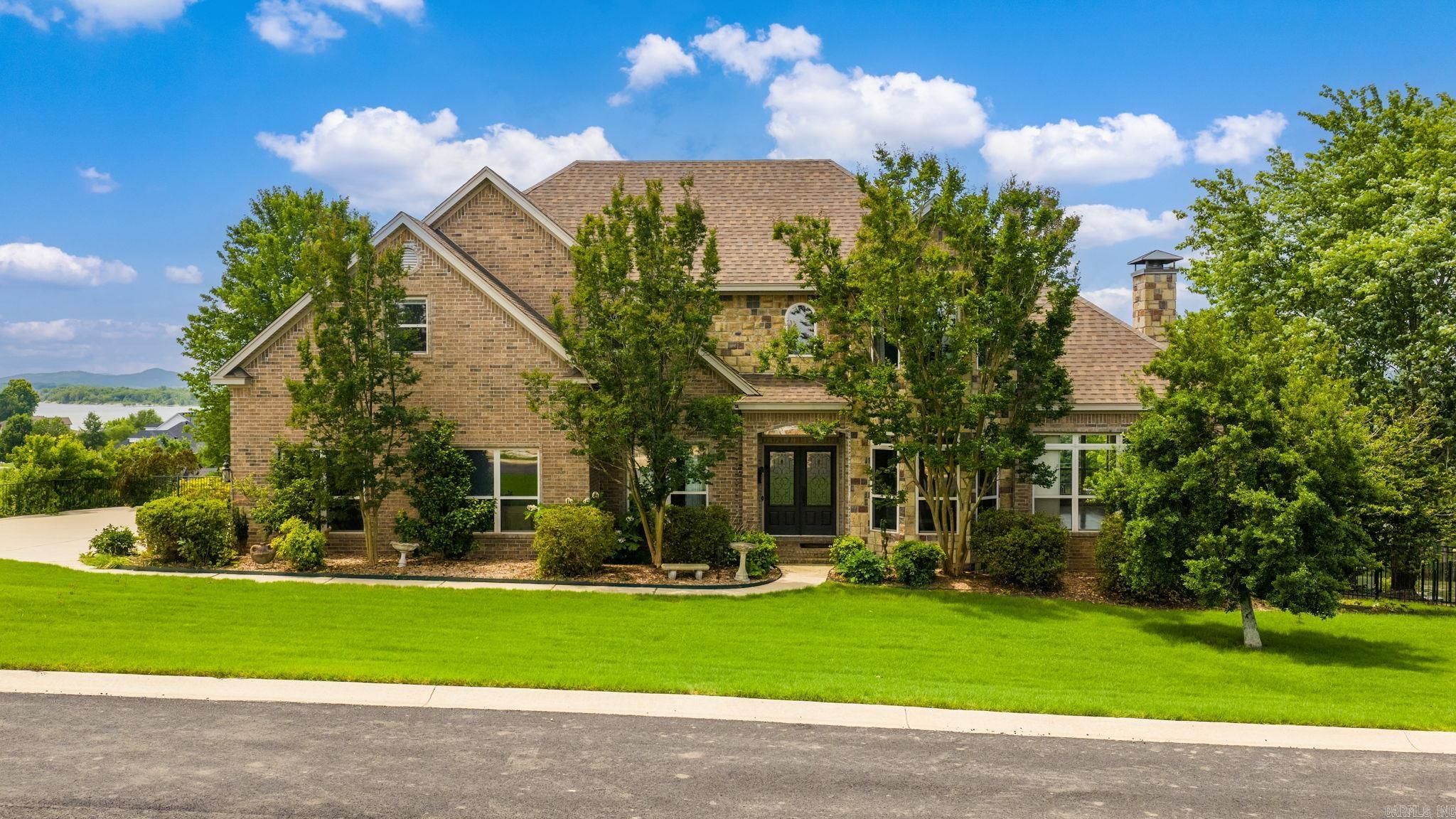 Well maintained custom home with year round views of the Arkansas River and Pinnacle Mountain! This property offers a spacious layout with quality features throughout, including a private primary suite with a sitting area and access to a balcony, double sided fireplace, and heated bathroom floors. The kitchen features granite countertops, a gas stove, and ample workspace for everyday living and entertaining. Recent updates include infinity-level HVAC systems installed for both levels in 2020, a roof replacement in 2022, and a tankless water heater installed in 2024. Additional features include automatic blinds installed in July of last year on the main level, fiber internet availability, storm shelter located beneath the garage, and a three-car garage with new door motors. Outdoor spaces are designed to enjoy the surrounding scenery with mature landscaping and a large back deck overlooking the river views. Convenient access to nearby amenities while offering a peaceful setting with standout views and functional upgrades throughout. *additional opportunity to purchase the 0.44-acre lot below the house, see River Road Cove, MLS #26021458*