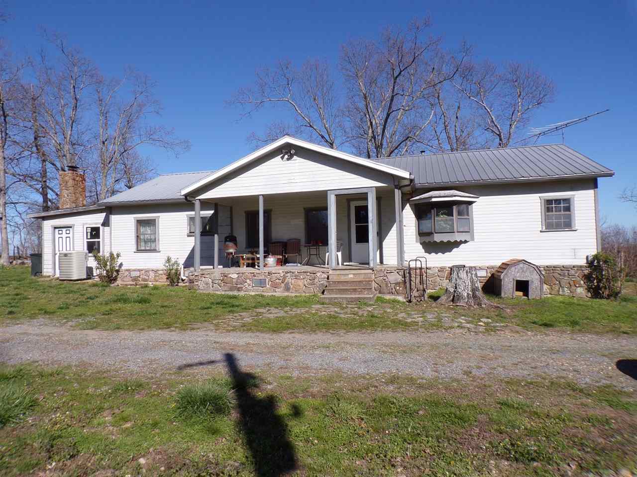 Country home on 20 acres between Leslie and Mountain View, AR. 3-4 acres of open area and remaining acreage is wooded with ATV trails. Excellent deer hunting. Spring and cave on property. Fruit trees and garden spot. House has been re-wired and re-plumbed. New H&A. Some finishing touches needed/trim and doors available. Garage apt with 1 bedroom, bathroom and kitchen. Some finishing touches needed. 19.6'x24' garage/shop with electric garage door.  2 water wells. Near Buffalo National River.MOTIVATED SELLER