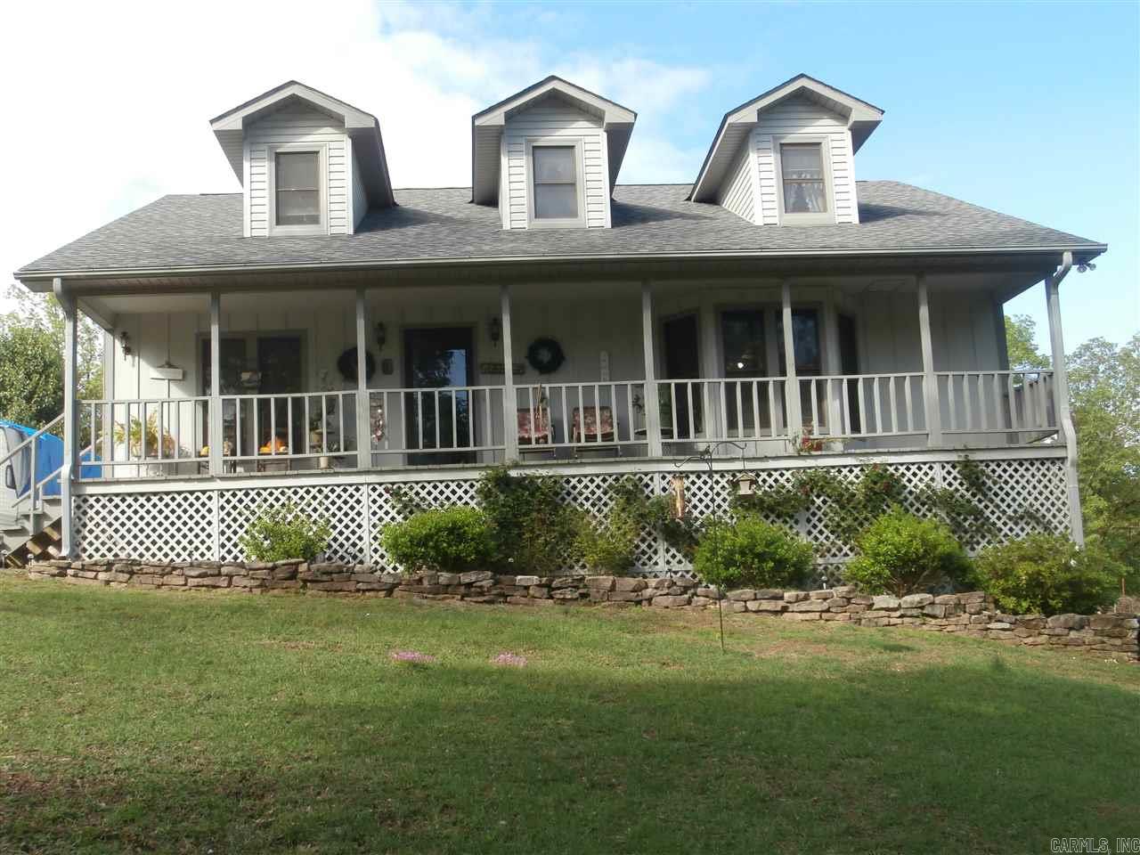 This is a beautiful custom built 3 bed. 2 ba. home located in the Magnet Cove Sch.Dist. Hardwood floors and oak cabinets throughout. 3 acres in a restricted subdivision that has the appearance of instant seclusion the minute you drive up the black top drive.  Approx.2160 Sq.ft of Central Heat and Air space, PLUS a ground entry basement that is currently the double garage but could quickly become extra game room space or hobby area.  It has a wood burning heater and is naturally cool in the summer.