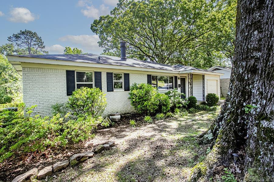 Nestled in the heart of historic Park Hill, this gorgeous all-brick 3 bedroom, 1 bath home is full of charm and character, and a true park like setting.  Beautifully updated with a remodeled bathroom to include a porcelain tub. This home has the original 3/4-inch gleaming hardwood floors, fresh paint throughout, this home has been lovingly cared for and is move- in ready.  Situated on approximately a one third acre lot, the beautifully landscaped yard with mature trees creates a peaceful, park-like retreat perfect for relaxing or entertaining. Home has new windows, HVAC to include AC, furnace and ductwork.  Enjoy the beauty and privacy of this incredible outdoor space right in the city. The location leads to easy exits to both main thoroughfares, and the street with a beautiful canopy. The wildlife from the creek and lakes bring a unique song. Hot summers are cool inside because of the shade trees and new cooling system.   A home with this much charm, land and setting in Park Hill are rare. A must-see that will not last long! Schedule a showing today!