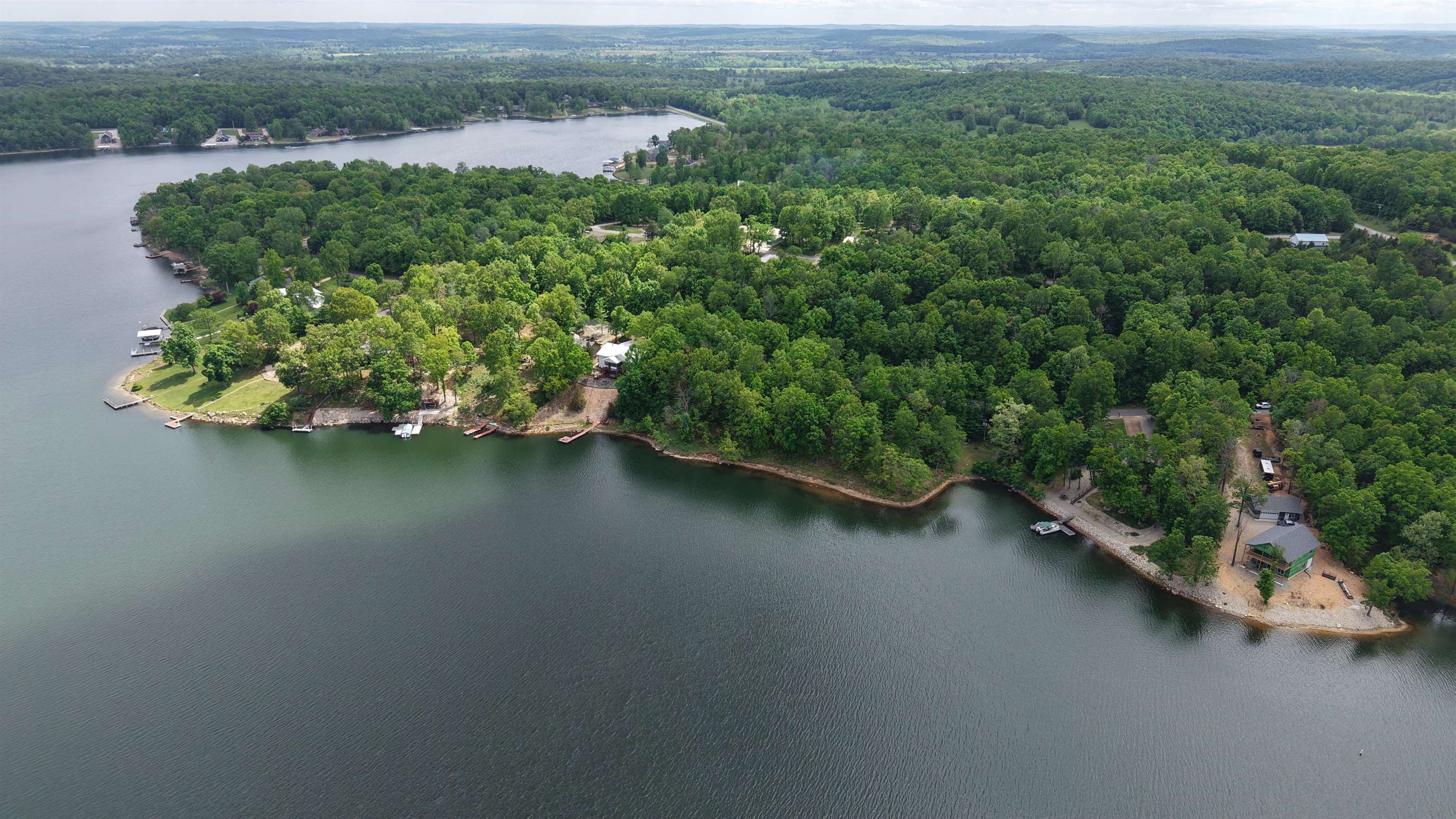 Looking for an affordable lakefront property in the Ozarks where you can build your dream home or recreational getaway? This wooded lakefront Lot 7 in the Crownview Addition of Horseshoe Bend, Arkansas offers direct access to beautiful Crown Lake and scenic views. All utilities are available on the property, making it ready for construction and saving you time and expense. Whether you’re planning a full-time residence, vacation retreat, or investment opportunity, this lot is well-suited for your vision. Crown Lake is known for its excellent recreational opportunities including fishing, boating, kayaking, swimming, and more. Enjoy the small town surroundings while still having access to all the outdoor activities and local amenities the area has to offer. Priced to sell at only $49,900, this is a great opportunity to secure lakefront property at an affordable price.