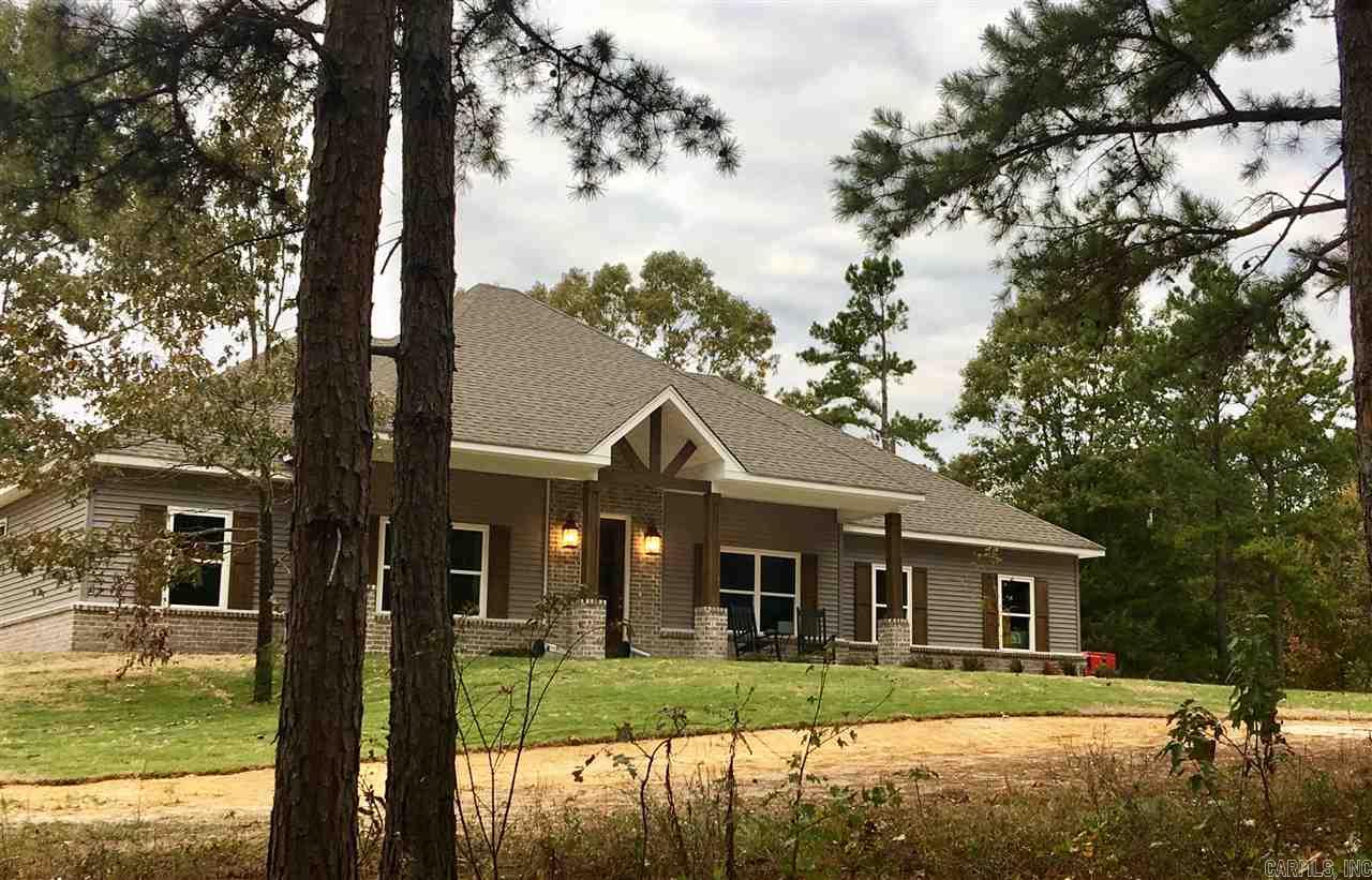 RURAL PROPERTY, NEW CONSTRUCTION, & CLOSE TO TOWN! THIS WONT LAST LONG!! THIS 2100 SQ FT HOME OFFERS 4BR/2  BA, SPLIT BDRM FLOORPLAN, GRTRM ROCK W/WOOD BURNING FIREPLACE, LIVING RM OPEN TO KITCHEN W/ LARGE ISLAND, LAUNDRY RM ,  GRANITE CNTRTOPS THROUGHOUT, HARDWOODS, TILE IN WET AREAS,  LARGE MASTER BATH W/SOAKER TUB, SEPARATE SHOWER & WALK-IN CLOSETS, CROWN MOLDING EVERYWHERE, PRIVACY, BRYANT SCHOOLS & MUCH MORE!!!  Please measure to determine square footage accuracy.