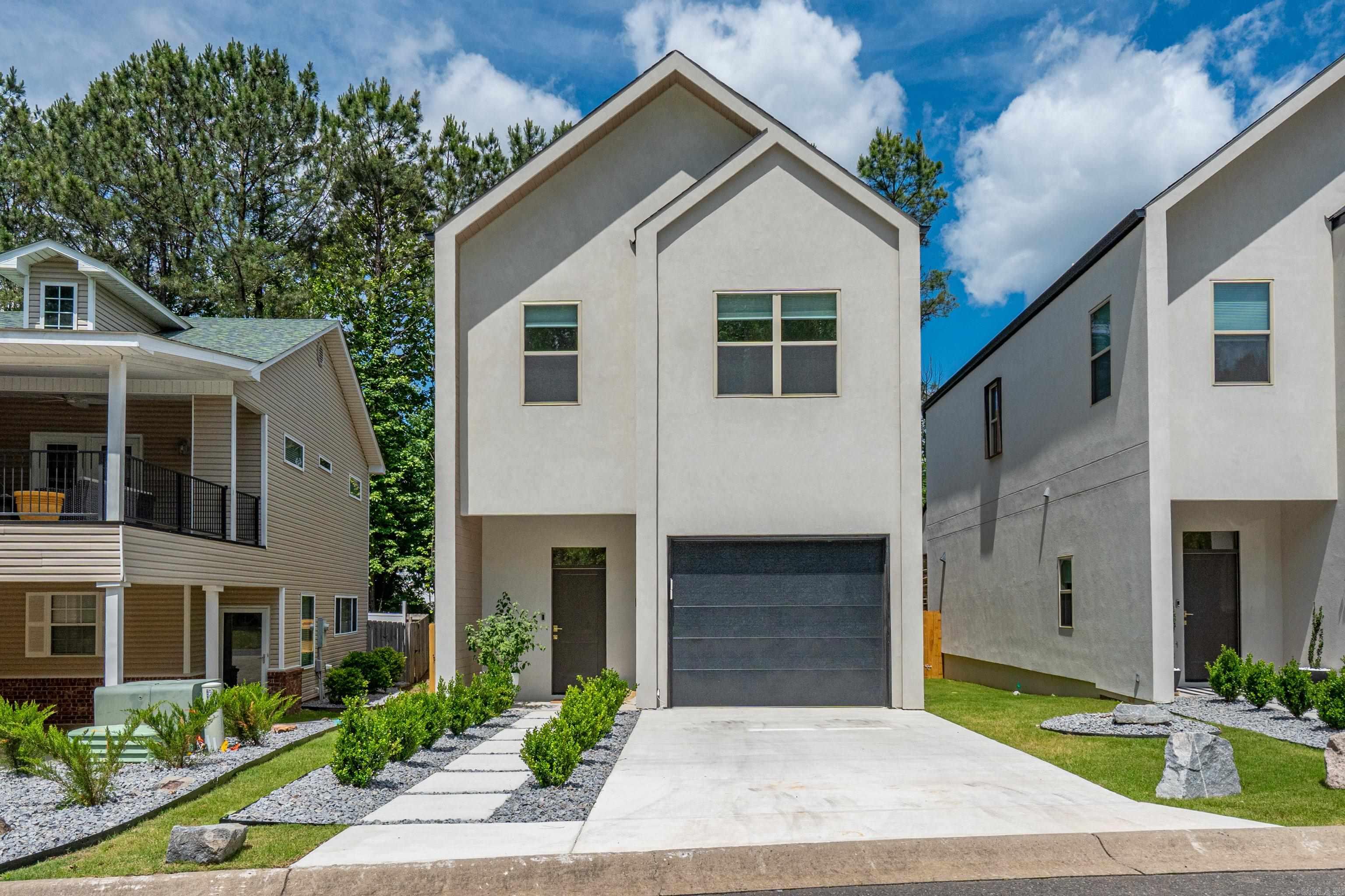 New build in 2025, this pristine townhome with clean lines an a contemporary feel is ideally located just off Central Avenue with lake access, dining, shopping, hospitals and more, just minutes away.  Custom cabinets with Taj Mahal quartz in the kitchen and an open dining/living concept is sure to appeal to all.  Stainless appliances and a walk in pantry accompany the kitchen as well as a spacious, private, covered patio for more space and entertaining.  Attention to detail such as custom tile and gold finishes throughout give extra emphasis to this move-in ready property.