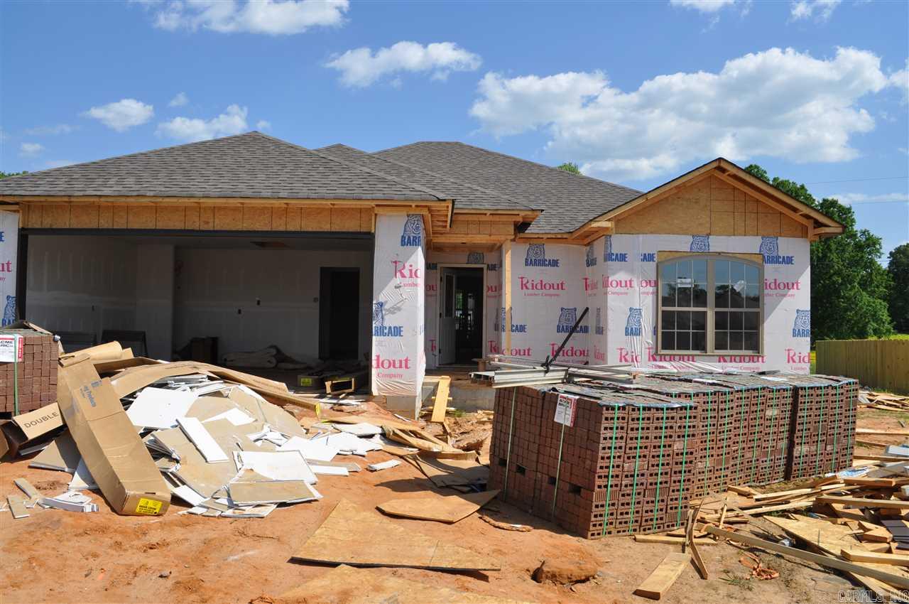 This one is going to be beautiful! Bricked archway leads to a large living room with wood flooring, kitchen will have tons of cabinets, pretty glass tile backsplash and granite counter tops.  Master bedroom is separate with walk in closet,  master bath will have granite countertops, separate jetted tub and tiled shower.  Covered back patio overlooking huge back yard.  Choose this one early and pick some colors!  Approximate completion date is May 2015.