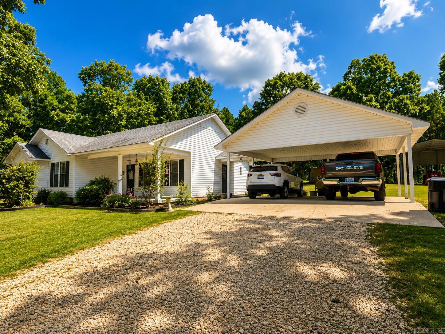 Homes like these are hard to find in this price range*remolded in 2025*county living on a little acreage with mature trees*luxury vinyl planking throughout*HVAC 2020*Roof 2017*huge-covered patio with tongue n groove pine ceiling*vaulted ceiling in living room*kitchen has newer appliances, pull out drawers behind some the cabinet doors and quartz counters*the kitchen also a large kitchen island and the refrigerator stays*master bath has roomy shower and separate jetted tub*interior of house was completely painted this year*large laundry room*RV shed with electricity*nice 20x20 shop that has an attached 20x20 attached carport*water heater 2021*chicken coop with chickens will stay if buyer wants them*house is has a generator plug*the small storage building by back door does not stay*some piictures are AI*