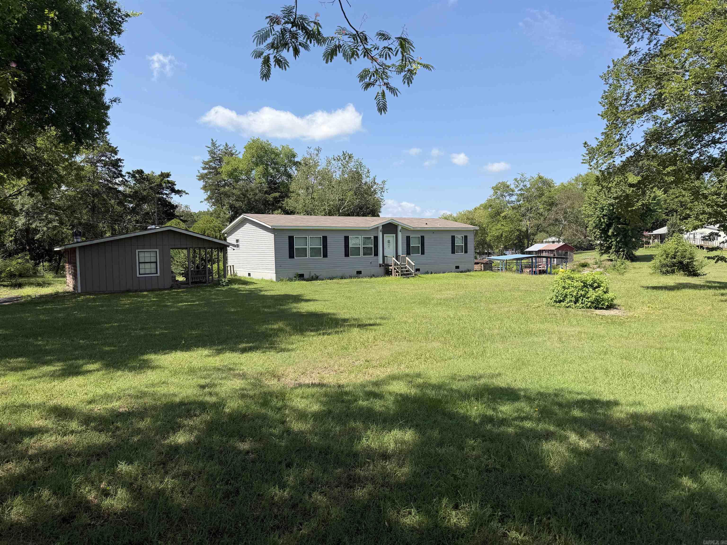 I FOUND IT!!! YOU CAN WAKE UP TO BREATHTAKING LAKE VIEWS IN THIS BEAUTIFUL HOME SITUATED WITH 189 FEET OF BEAUTIFUL LAKE HAMILTON FRONTAGE.  WHETHER YOU'RE LOOKING FOR A FULL-TIME RESIDENCE, VACATION GETAWAY OR INVESTMENT PROPERTY, THIS WATERFRONT GEM OFFERS ENDLESS POSSIBILITIES. ENJOY DIRECT ACCESS TO THE LAKE WITH YOU PRIVATE BOAT DOCK.  THE PROPERTY IS WELL-EQUIPPED FOR FUTURE EXPANSION WITH 2 SEPTIC SYSTEMS IN PLACE ALONG WITH CITY WATER. NOW LET'S TALK ABOUT HOBBIES....THERE ARE 2 SPACIOUS SHOPS A 24X14 WORKSHOP AND A 24X30 SHOP PROVIDING PLENTY OF SPACE FOR BOATS, VEHICLES, TOOLS OR RECREATIONAL EQUIPMENT.   THIS RARE LAKE HAMILTON PROPERTY OFFERS THE PERFECT COMBINATION OF COMFORT, CONVENIENCE AND WATERFRONT LIVING.  DON'T LET THIS OPPORTUNITY SLIP AWAY (DID YOU CATCH THAT???)!!!  OWN YOUR OWN SLICE OF PARADISE ON ONE OF ARKANSAS'S MOST DESIRABLE LAKES.   AGENTS SEE REMARKS  DISCLAIMER: PICTURES WITH FURNITURE ARE FROM WHEN IT WAS STAGED AS A NEW HOME.