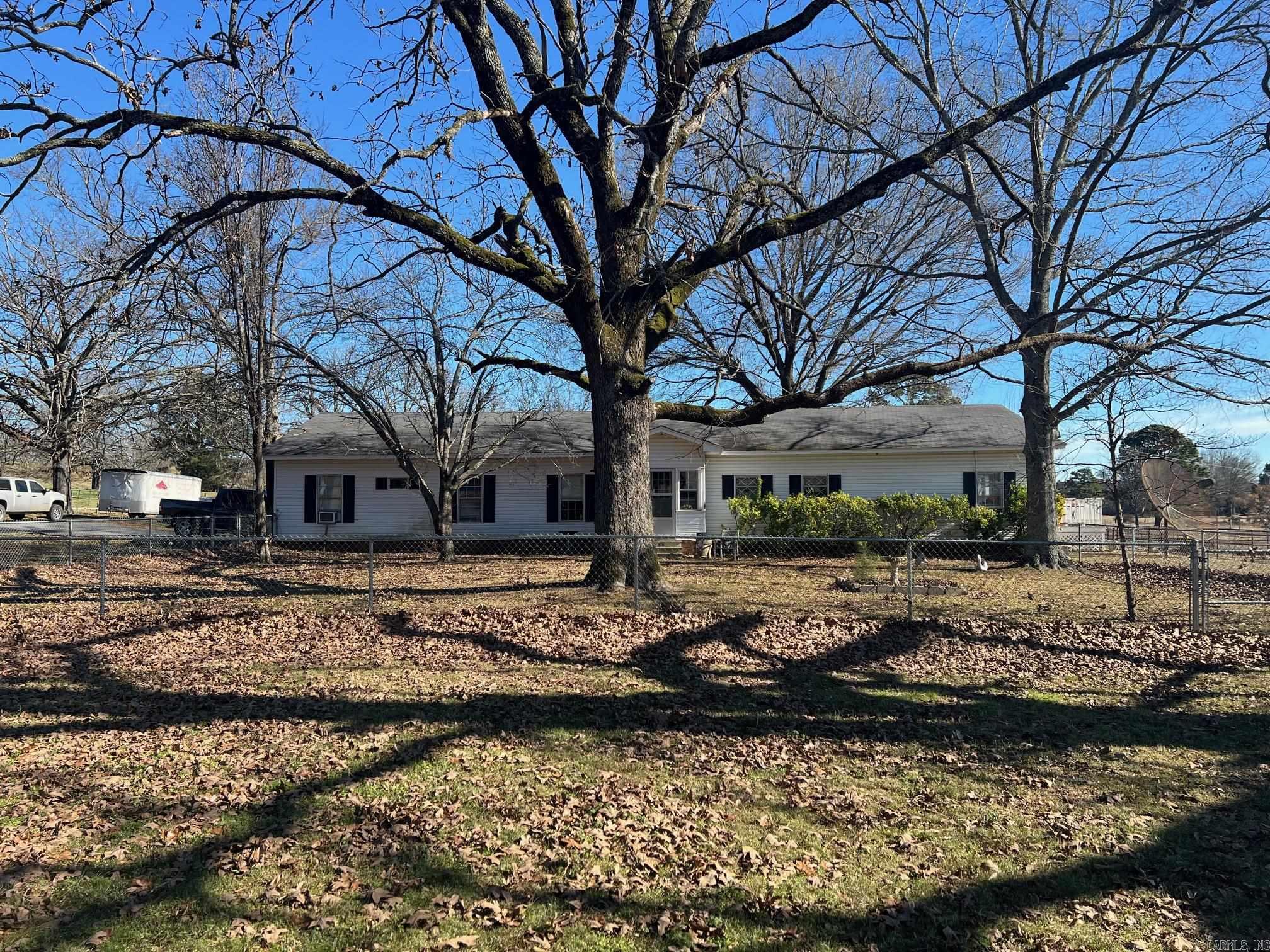 Wonderful opportunity to acquire 26 acres minutes from Lake Beaverfork and Conway city limits.  The property has been used for cattle for many years.  There is a good pond, haybarn, and covered area for working stock.  The farm produced good hay, it was set up for rotational grazing.  The home is a older single wide mobile home that has been built onto.  Has covered parking and backup whole home generator.  Three bedroom/Two baths