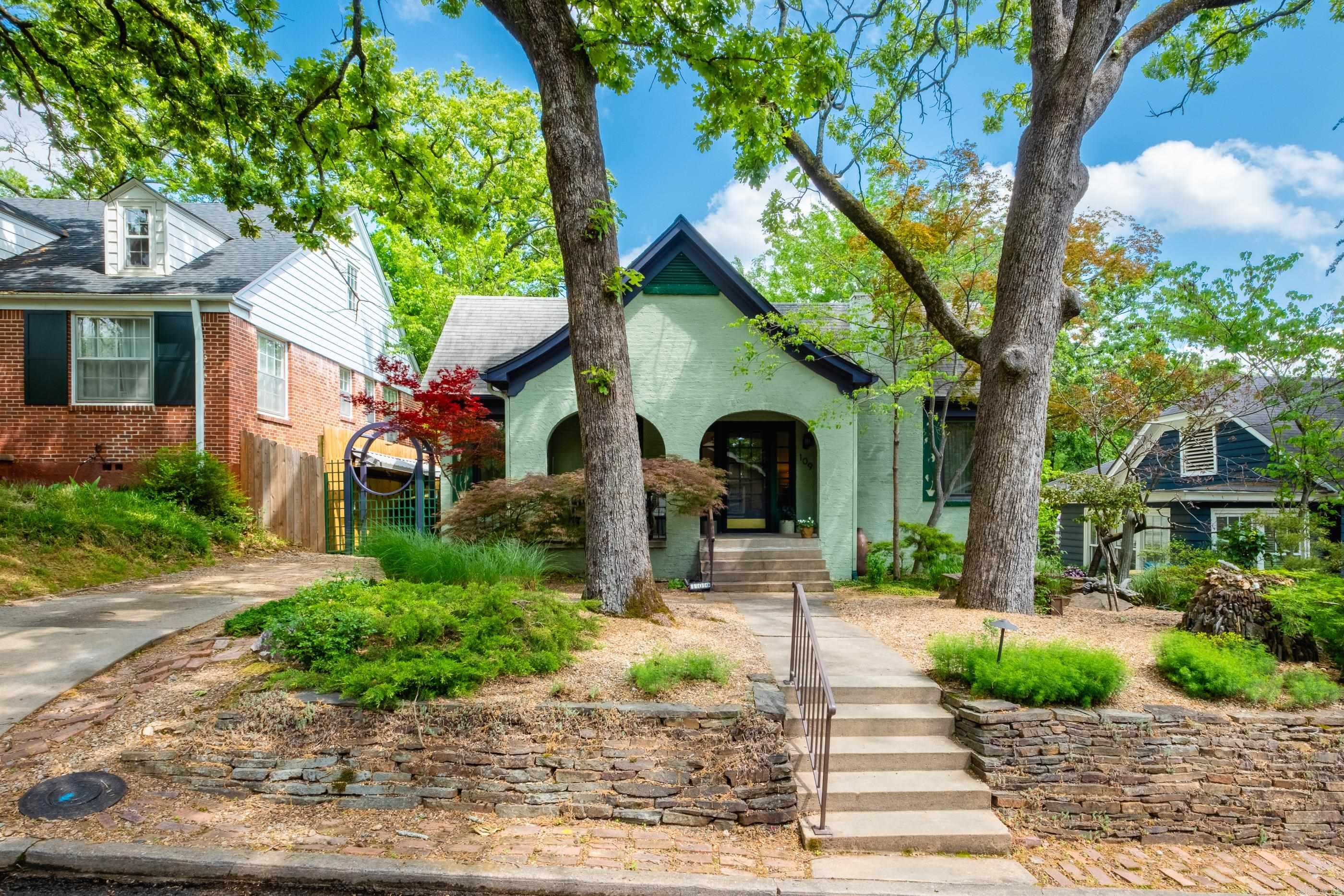 In the heart of Hillcrest, this beautifully updated bungalow offers a rare blend of historic charm, thoughtful updates, & serene outdoor living. From the moment you arrive, you'll appreciate the warmth, character, & inviting atmosphere that make this home truly special. The functional 2BR/2.5BA layout features comfortable living spaces designed for both everyday living & effortless entertaining, while natural light streams through the sunroom, creating a bright & welcoming ambiance throughout.  One of the home's exceptional features is the stunning Zen inspired Japanese garden. Designed to evoke balance & tranquility, this backyard sanctuary is filled with unique details, hidden treasures, & carefully curated elements that create a peaceful retreat unlike anything else in the neighborhood.  Adding remarkable flexibility, the fully finished upstairs bonus room offers more than 300 sq ft of heated & cooled living space, ideal as a third bedroom, guest suite, home office, playroom, or studio. An easily accessible, floored attic provides abundant storage. Combining versatility, character, & an extraordinary outdoor setting, this Hillcrest gem offers not just a home but a lifestyle.