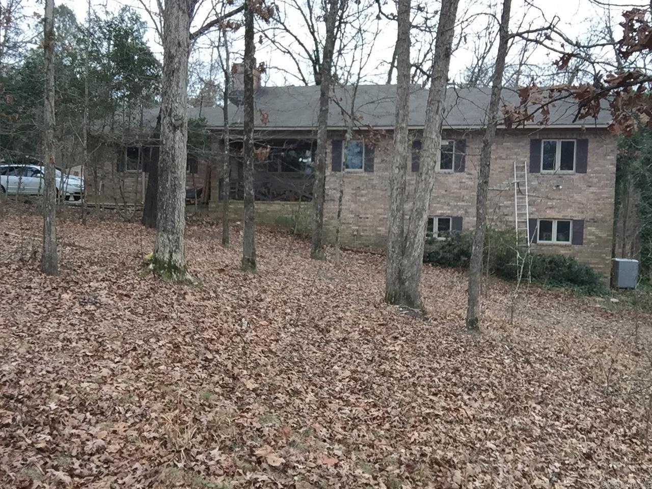 Take the private drive to your new home that sits on 3 ac. This brick veneer family home is nestled in a quiet, semi-secluded section of the property. 4 bdrm, 4-bath home is ready for lrg family & gatherings for every occasion. Once u pass the foyer the home opens to the LR/DR combo w/cathedral ceiling for that big home feel. DR/LR is just off a corner coffee nook that leads into the beautifully designed kitchen. Upper/lower cabinets w/stainless steels appliances and country sink, overlooking the enormous bkyrd, wooddeck and an above ground swimming pool for summer fun. The first level has the MBR w/new shower. The laundry closet and 2nd bdrm is just outside MBR. There is an office that can be a 3rd bdrm if needed. There is also a sunroom just off the kitchen. Hrdwd floors kitchen, LR/DR. Stairwell leads to the in-laws qtrs on the left & lrg family rm right where the 4th bdrm & bth are. In-laws qtrs has kitchen, LR,1 bdrm, lrg closet and full bath. Lwrlv gives access to b-yrd. As you drive up to the home you will see lrg prkg pad, open workshop, & access to b-yrd. The mtg loan is assumable. See if you qualify bc the rate, right now, can be beat. Setup your showing today.