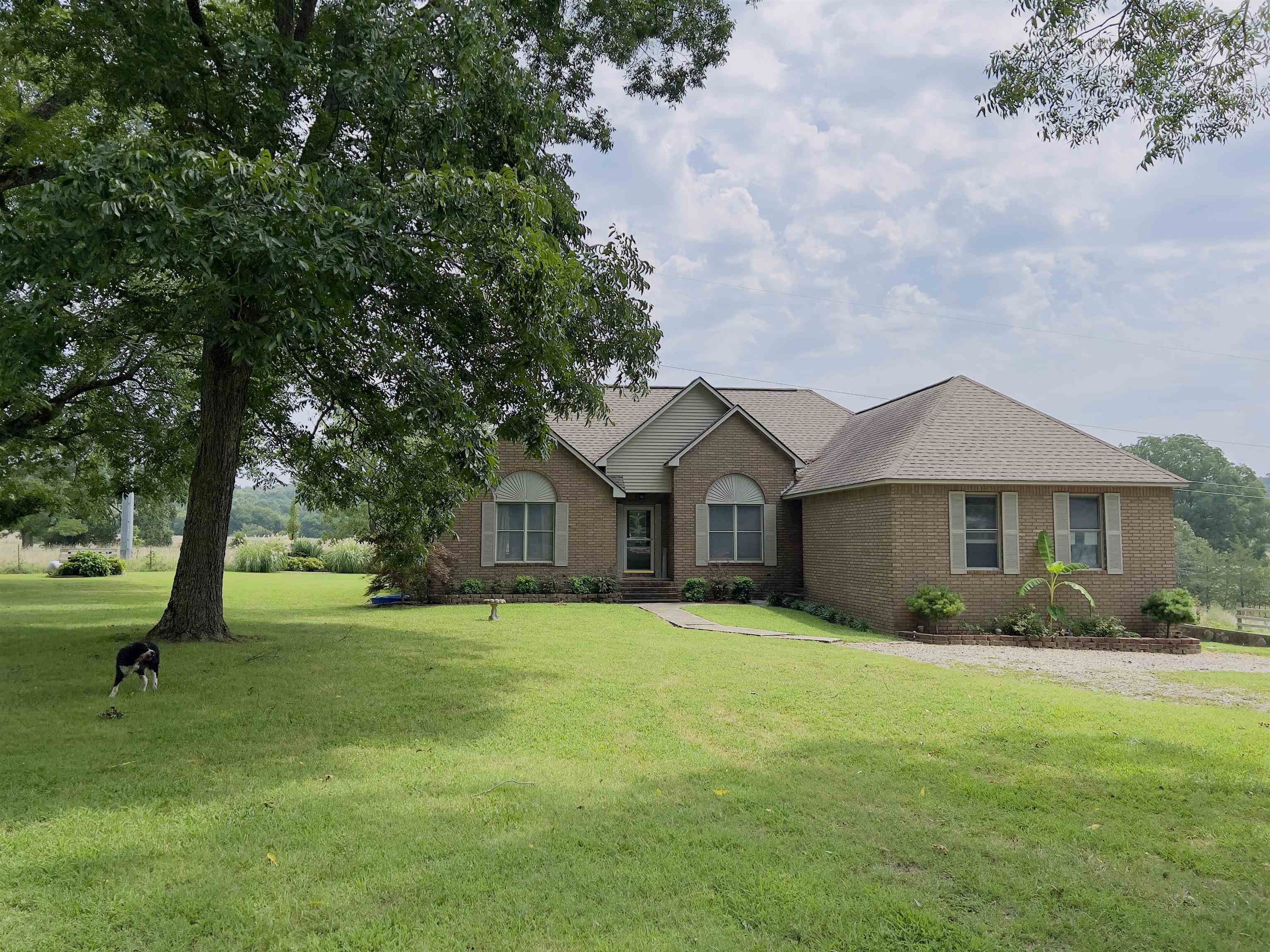 This home and acreage is nestled in the heart of the breathtaking Ozark Mountains of Mount Pleasant, Arkansas. It is within 11 miles of shopping and approximately 20 minutes from Batesville, AR.   You are greeted by a charming fence that surrounds the property. There are 10.75 acres with beautiful pecan and walnut trees that allow you to fully immerse yourself in the beauty of your surroundings.   Step inside this 1770 square foot home and be welcomed by an inviting living space with a fireplace and large windows. The kitchen is a is equipped with modern appliances, ample counter space, and a pantry.    This home features 3 bedrooms, with a possible 4th bedroom made from the upstairs space. The master bedroom features a spacious layout with an en-suite bathroom. It also features a spacious laundry room and garage for all your storage needs.   As you step outside, you are surrounded by the beauty of a 16 X 32 pool, complemented by a patio and hot tub. Additionally, there’s a 30 x 36 barn/garage with two, 12 ft lean-tos, providing convenient storage options for all your outdoor equipment and hobbies.  For all your animal needs, the property also has two pole sheds.   Only $335,000!