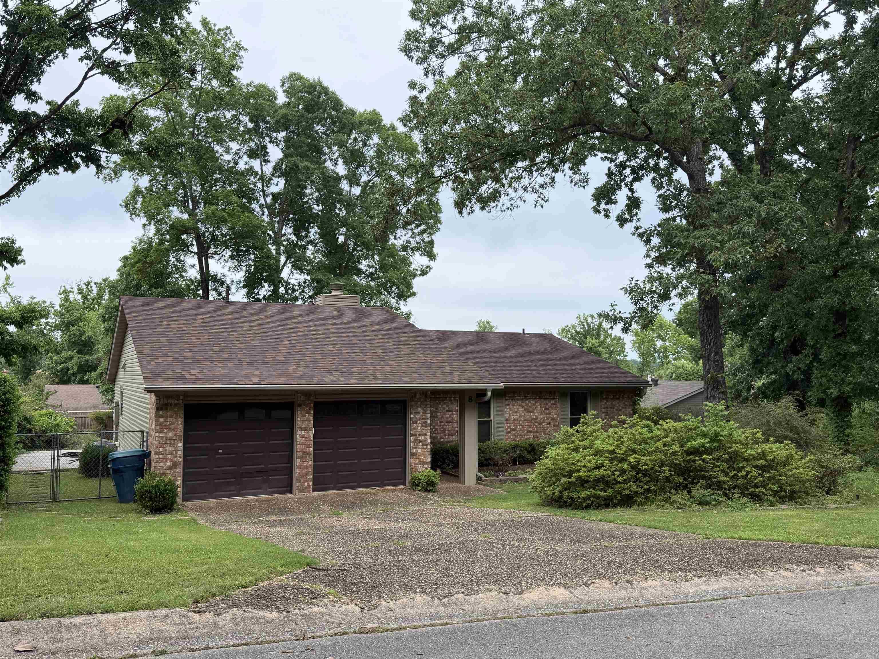 Welcome to 8 Markham Place Cir located in Little Rock! Make your appointment today to come check out this one-owner home located in a great neighborhood just minutes from shopping and dining! Situated on a spacious fenced lot, major updates include, a new roof in 2025, newer vinyl dual pane windows, vinyl siding, and a newer water heater giving buyers peace of mind on the big-ticket items. Both bathrooms have been nicely updated with solid surface finishes and glass sliding doors.  Enjoy the oversized living room featuring vaulted ceilings and a cozy gas fireplace. Functional layout includes a kitchen with adjoining dining area, ideal for everyday living and entertaining! With just a little fresh paint and new flooring, this home can truly shine making it an excellent option for first-time buyers, investors, or anyone looking to build instant equity!