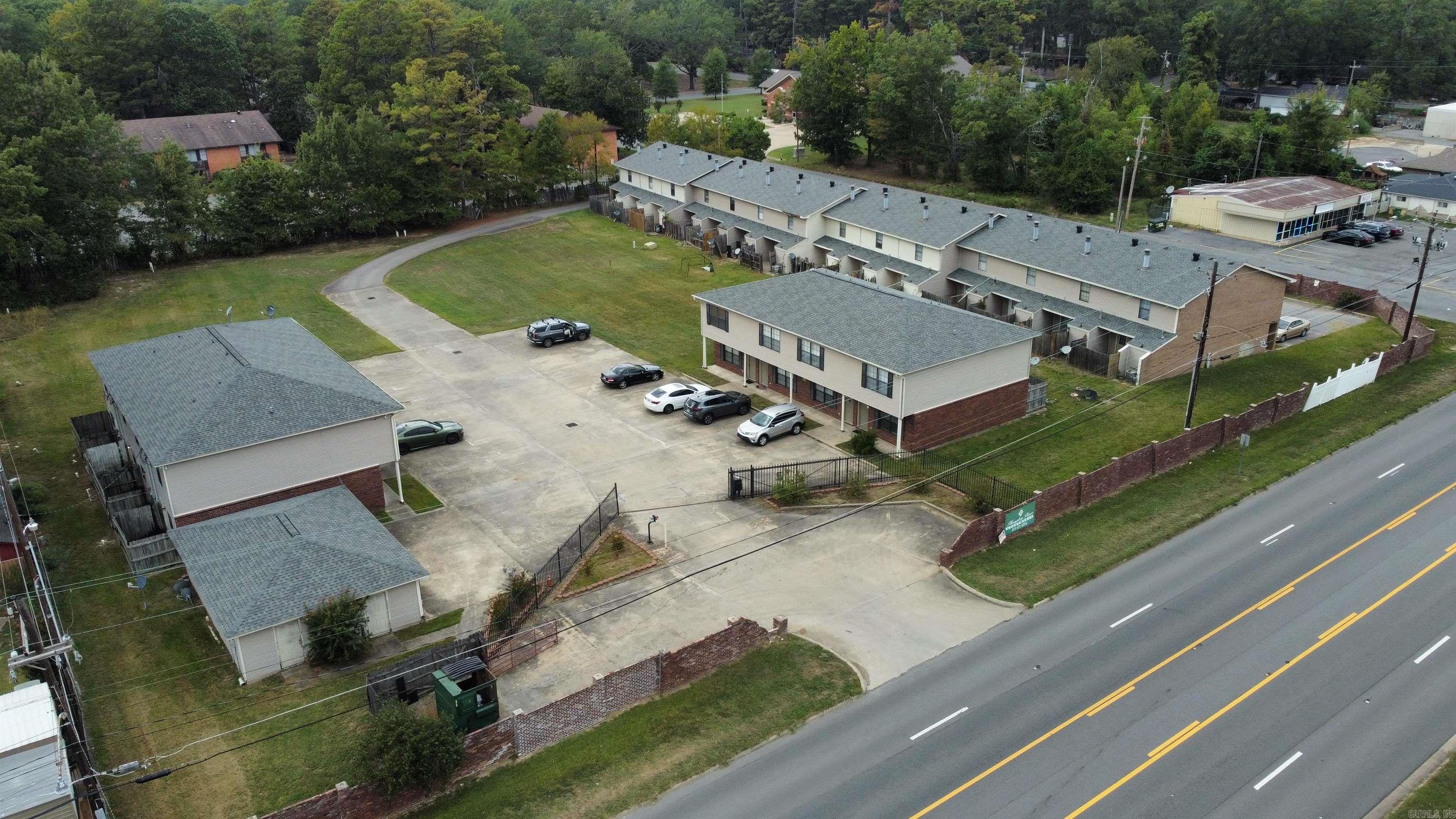 Fantastic investment opportunity in Pine Bluff! This well-maintained 22-unit apartment complex is currently 86% occupied, with 19 units rented and strong rental income in place. The property sits on a spacious lot with room to expand — infrastructure is already started, with plumbing in place for two additional buildings. This makes it an excellent value-add opportunity for investors looking to increase unit count and maximize returns. With consistent occupancy, growth potential, and a convenient location, this complex is perfect for both seasoned investors and those looking to scale their portfolio.