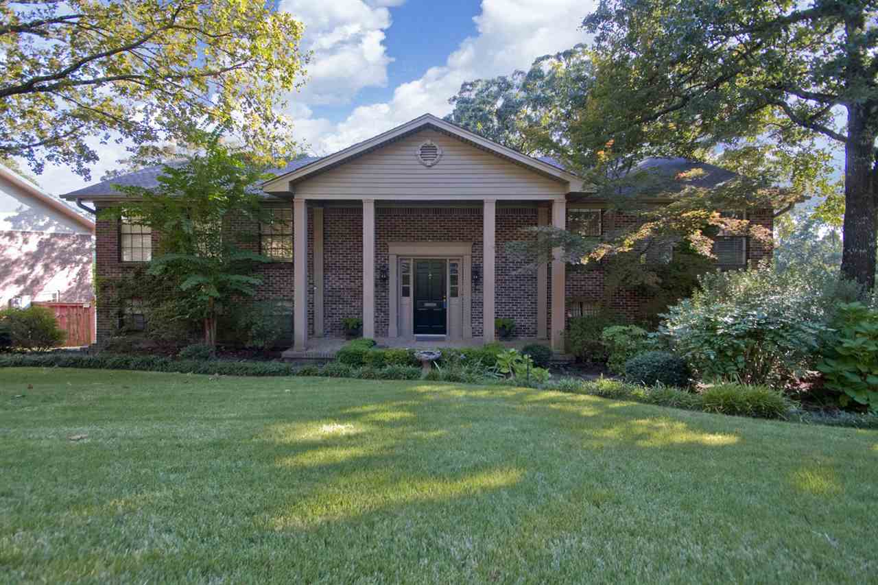 Nicely situated on a large corner lot with a view overlooking Foxcroft. This home has updated kitchen and master bath. The lower level family room has tile flooring, built in bookcases, wet bar and gas log fireplace. The main level Living room has  wood flooring, built in cabinets and entertainment center. Kitchen has updated cabinets, hardwood flooring, stainless steel appliances and breakfast nook. Oversized garage with built in storage and work benches.  New Roof 2011. Sprinkler system. Nice decks.
