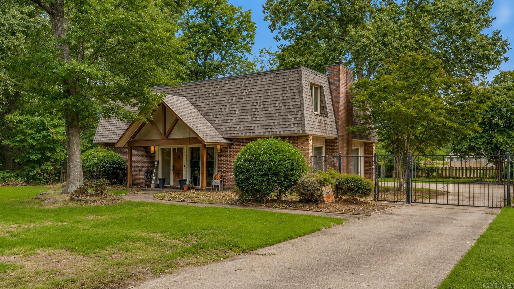 Welcome to this beautifully maintained all-brick home full of character and thoughtful updates! Located in a well-established Jonesboro neighborhood, this 3-bedroom, 2.5-bath home offers a unique floor plan with timeless charm throughout. Step inside to a bright foyer featuring a stunning wrought iron staircase, two spacious living areas, hardwood flooring, custom built-ins, and a cozy fireplace. The kitchen is equipped with granite countertops, tile backsplash, stainless steel appliances, abundant cabinetry, and a pantry with pull-out shelving. Upstairs, the spacious primary suite features dual vanities with granite countertops, a travertine walk-in shower, and a large walk-in closet. Outside, enjoy a beautifully landscaped backyard with decorative iron fencing, a sprinkler system, storage shed, and a private patio that's perfect for relaxing or entertaining. This is far from your average cookie-cutter home; don't miss your opportunity to make it yours. Schedule your private showing today!