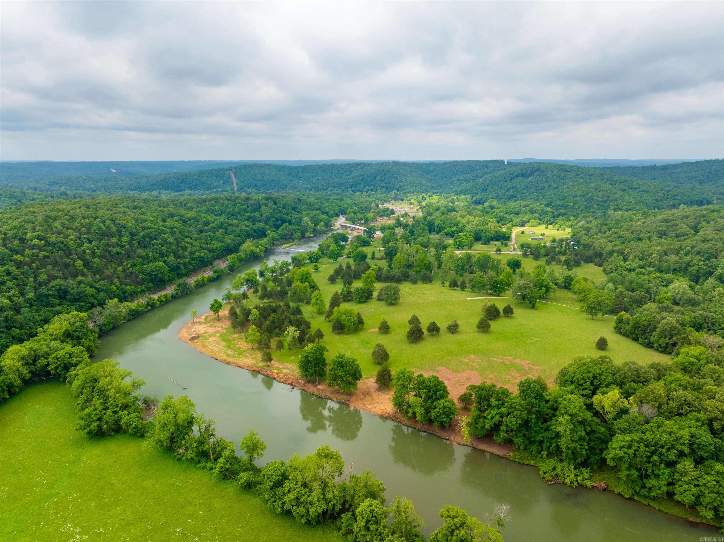 Spring River Lot – Ready to Build! Just Outside Hardy, AR  If you've been dreaming of owning property on the Spring River, here's your chance! This prime river lot comes ready to build, with water and electricity easements in place, a successful perk test, and an elevation certificate showing it's 2 feet above a 500-year flood level (per seller)—a rare find!   Located just minutes from historic downtown Hardy, this lot offers stunning views overlooking the beautiful Spring River. Whether you're looking to build a vacation cabin, forever home, or weekend getaway, this spot has everything in place to get started right away.  Address: 169 Spring Acre (new so it will not GPS yet) Utilities Easement Perk Test Completed Elevation Certificate on File Peaceful Setting with Gorgeous River Views