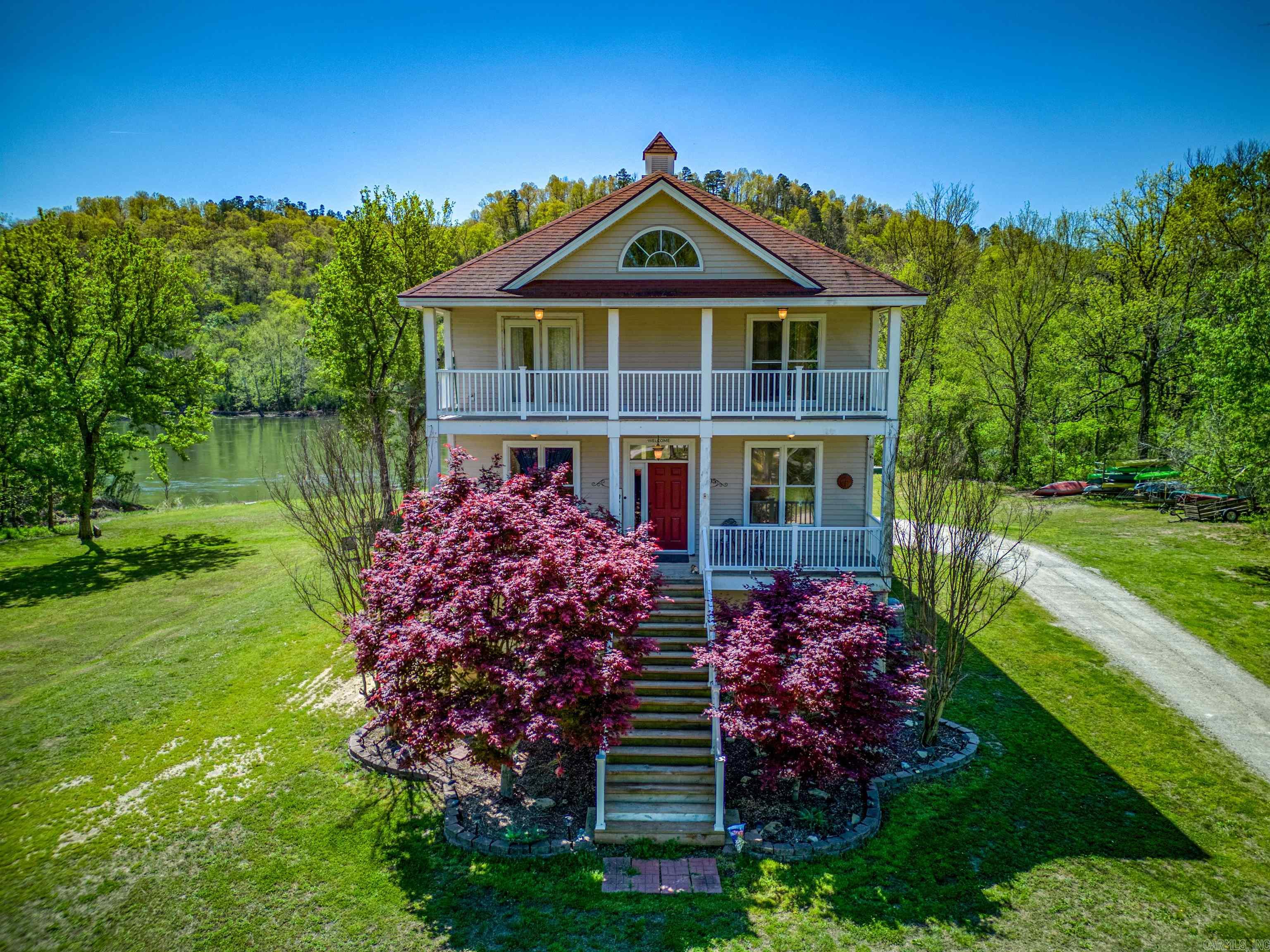 Imagine one of the most peaceful spots in the world.  Would you think it's located on the beautiful White River in Norfork, Arkansas?  Well, it is!  This property hosts a potential sleeping capacity of at least 34 guests or however many friends and family you want to invite.  With four well maintained structures, a perfectly manicured 8+ acres and the most hidden, fruitful trout-fishing waters in the world this property offers endless possibilities.  The lodge can host big get-togethers. There are private cabins with Jacuzzis on screened in back porches to snuggle down and listen to a quiet creek.  Then last, but definitely not least, a pristine main river house that offers 400 ft. of beautiful river views.  This property is completely turnkey with most contents conveying with a reasonable offer.  The property boasts two RV hooks ups, canoe rentals and the ability to host large events like weddings and family reunions. The options are just endless. Book your private showing today.  Agents, please contact the listing agent for more information.