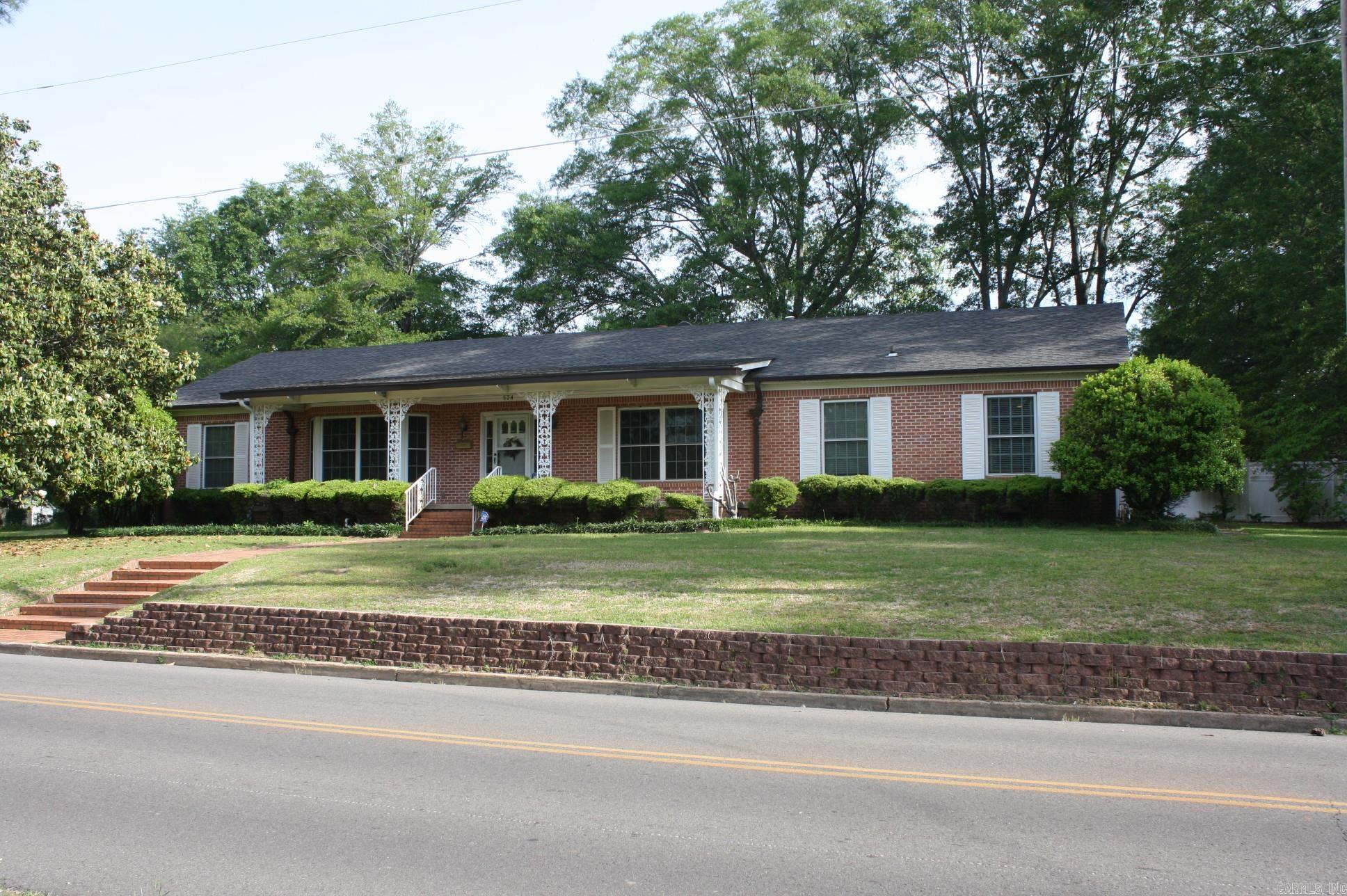 3 or 4 Bedroom, 3.5 Baths home on corner lot in the heart of Nashville.  Large bonus room can be used for bedroom, office, apartment or game  room.  Kitchen is very spacious with plenty of cabinets and counter space.  Home offers formal living area and a large family area with wood burning fireplace.  Central heat & A/C.  Two car attached garage.  Property offers very nice storage building with covered porch.  Vinyl fenced back yard and lawn sprinkler system.  Range and refrigerator convey with sale of home.  New roof in 2024.