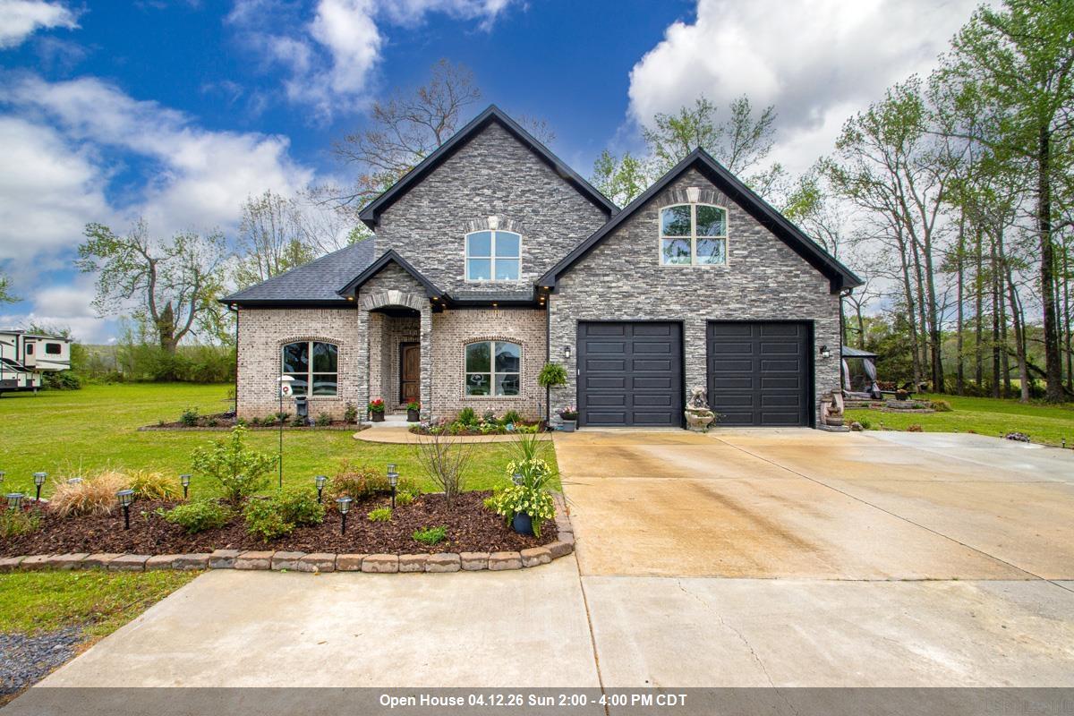 Welcome Home, to this country home sitting on 2.47 acres in a gated community of Annis Estates. You will love the open floor plan with vaulted ceilings with custom build-ins.Kitchen features double ovens and a gas range,granite counter tops.Upstairs is a loft perfect for a gaming area.The back patio ia a real treat for entertaining friends and family. Must See!!
