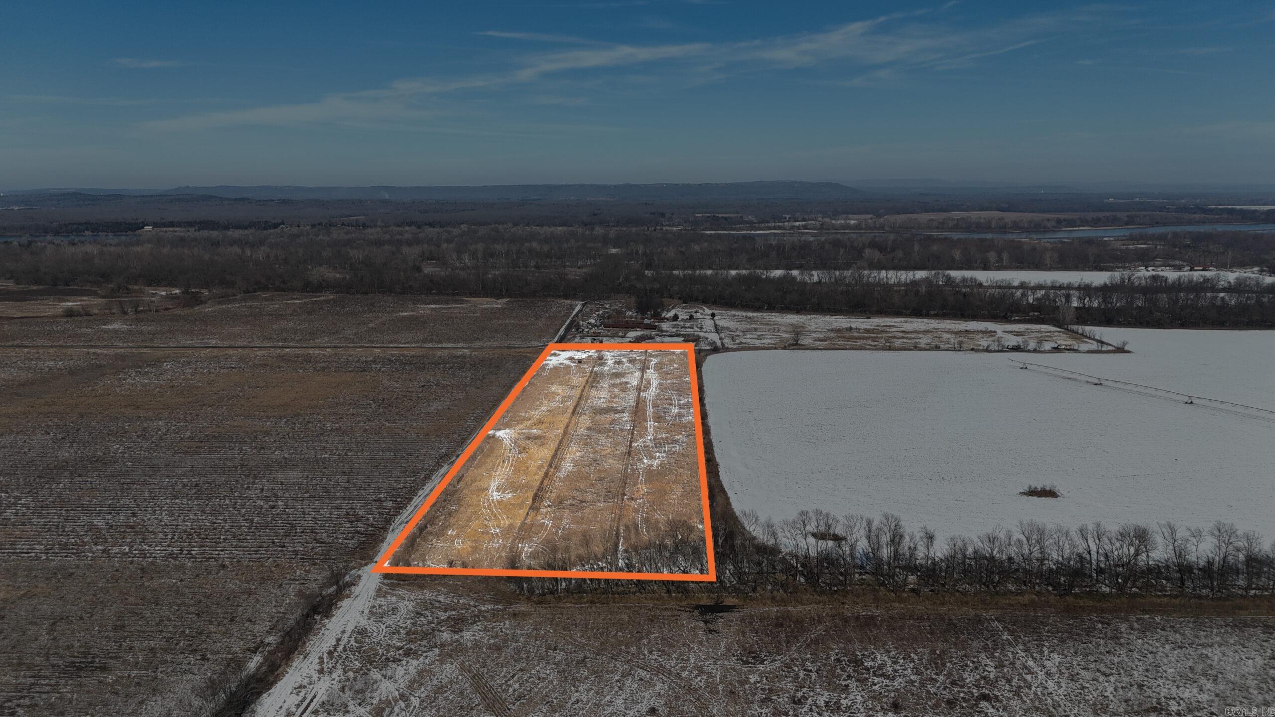 10+/- tillable acres in Carden Bottoms  10+/- acres of rich alluvial flood plain at the end of Carden Bottoms Rd at the foot of Petit Jean Mountain in northwestern Yell County. Class IIe Roxana silt loam soil, ready for hay production or row crop, Excellent access to this acreage from road frontage. Electricity on the roadway. Whether you are looking to add to your existing farm in the area or build  an out of the way hunting camp, this is the spot for you! Abundant waterfowl,dove and deer thrive in this region of the Arkansas River Valley. It’s only a short drive to Holla Bend National Wildlife Refuge and Petit Jean State Park.