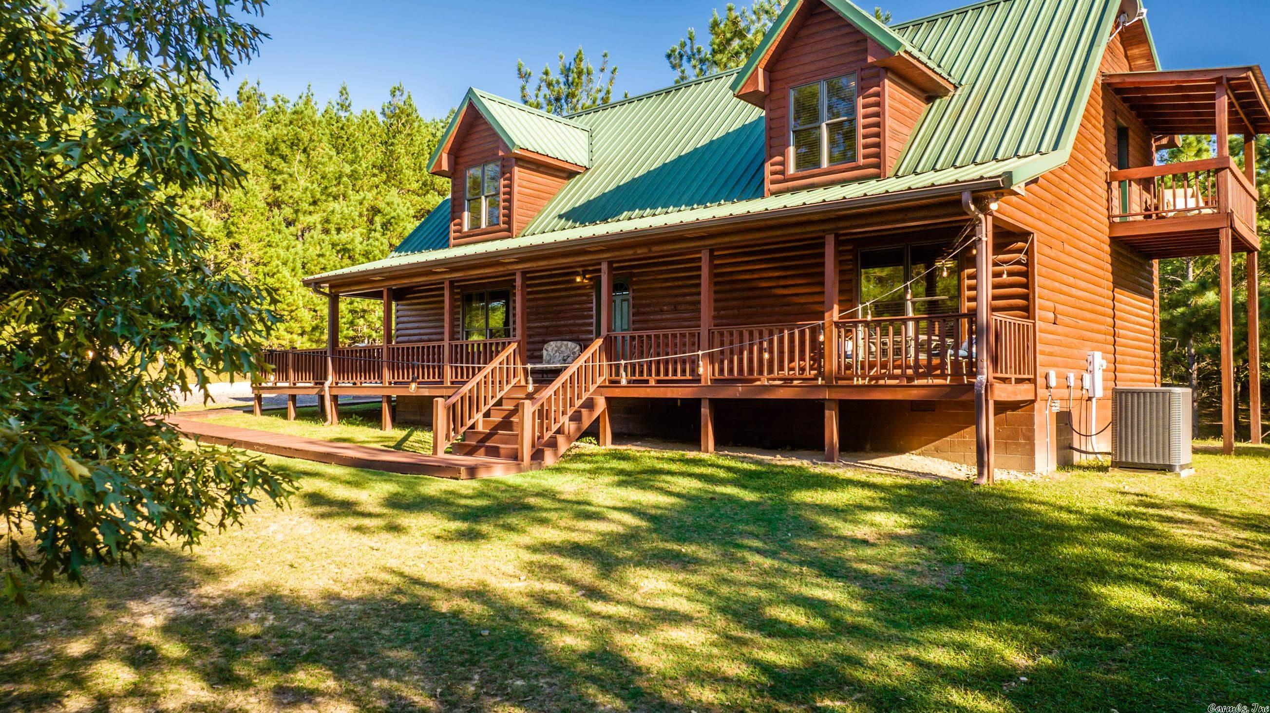 Timber Lodge Ranch, in the foothills of the Ouachita Mountains in Amity, AR, is a gated, fully fenced 153 ac. ranch w/ a 36 ac. Spring fed lake hosting 101 guests in 9 guest houses as a corporate retreat, family compound, event center, VRBO investment, 1031 exchange or youth camp. Recreation hall, newly refinished indoor sports pool, indoor games spaces, commercial kitchen & beautiful hill top chapel make this property ideal for canoeing, kayaking, fishing, hiking, swimming, Bball, Vball, PPong & MORE!
