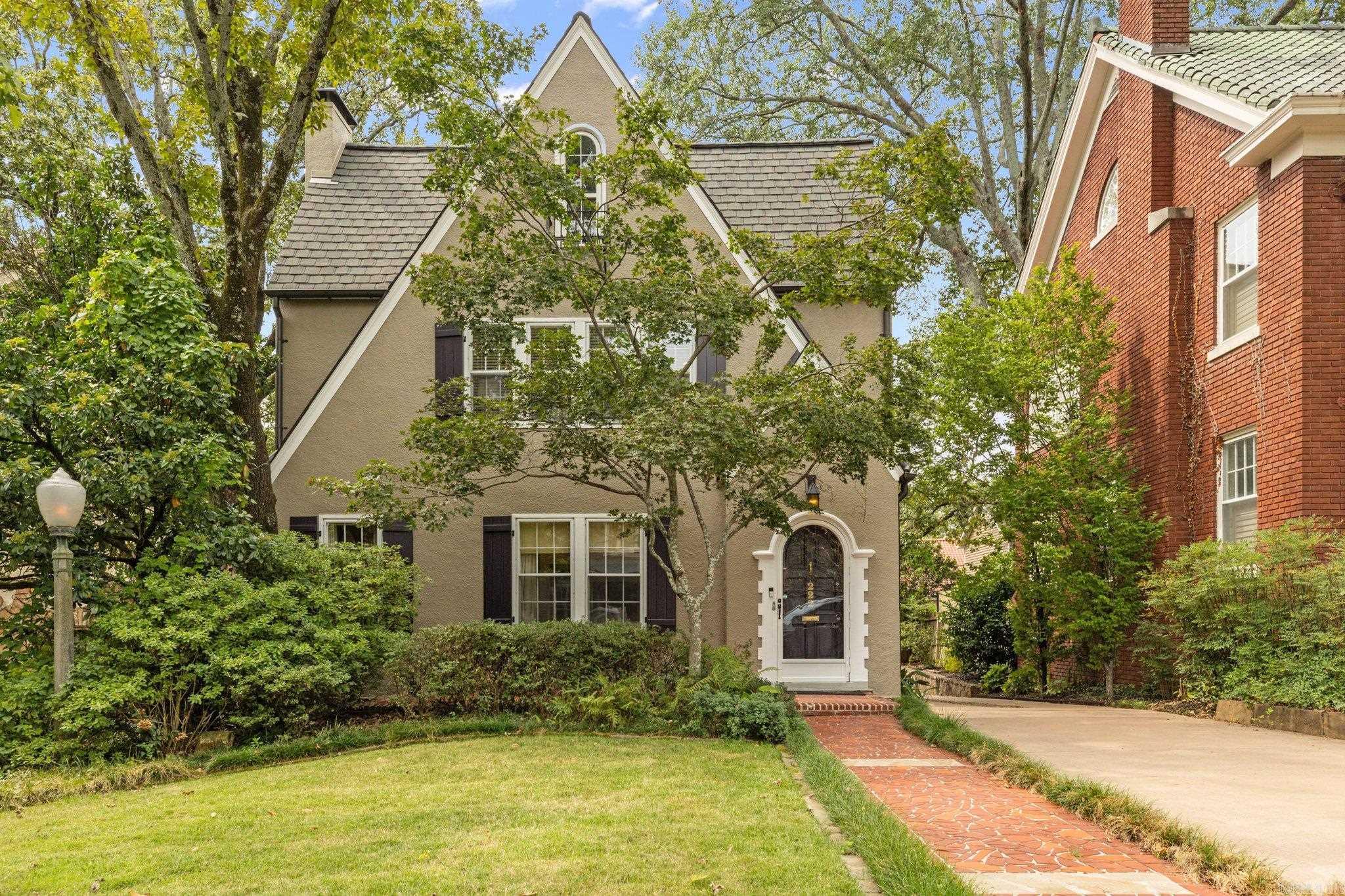 Welcome home to this beautifully maintained Hillcrest home features 4 bedrooms and 3.5 bathrooms with a blend of historic charm and modern comfort.  The dedicated dining room sets the stage for memorable gatherings, while the large kitchen island offers ample space for culinary creations. The spacious laundry room includes a full bathroom with shower that makes it easy for bathing pups!  The expansive primary bedroom includes a walk-in closet.  Outside, enjoy your private oasis featuring a flagstone patio and composite deck with sun shade, ideal for summer barbecues or cozy evenings.  The detached garage includes separate storage space with side door access, and the long driveway offers parking for multiple cars.  Agents, see remarks.