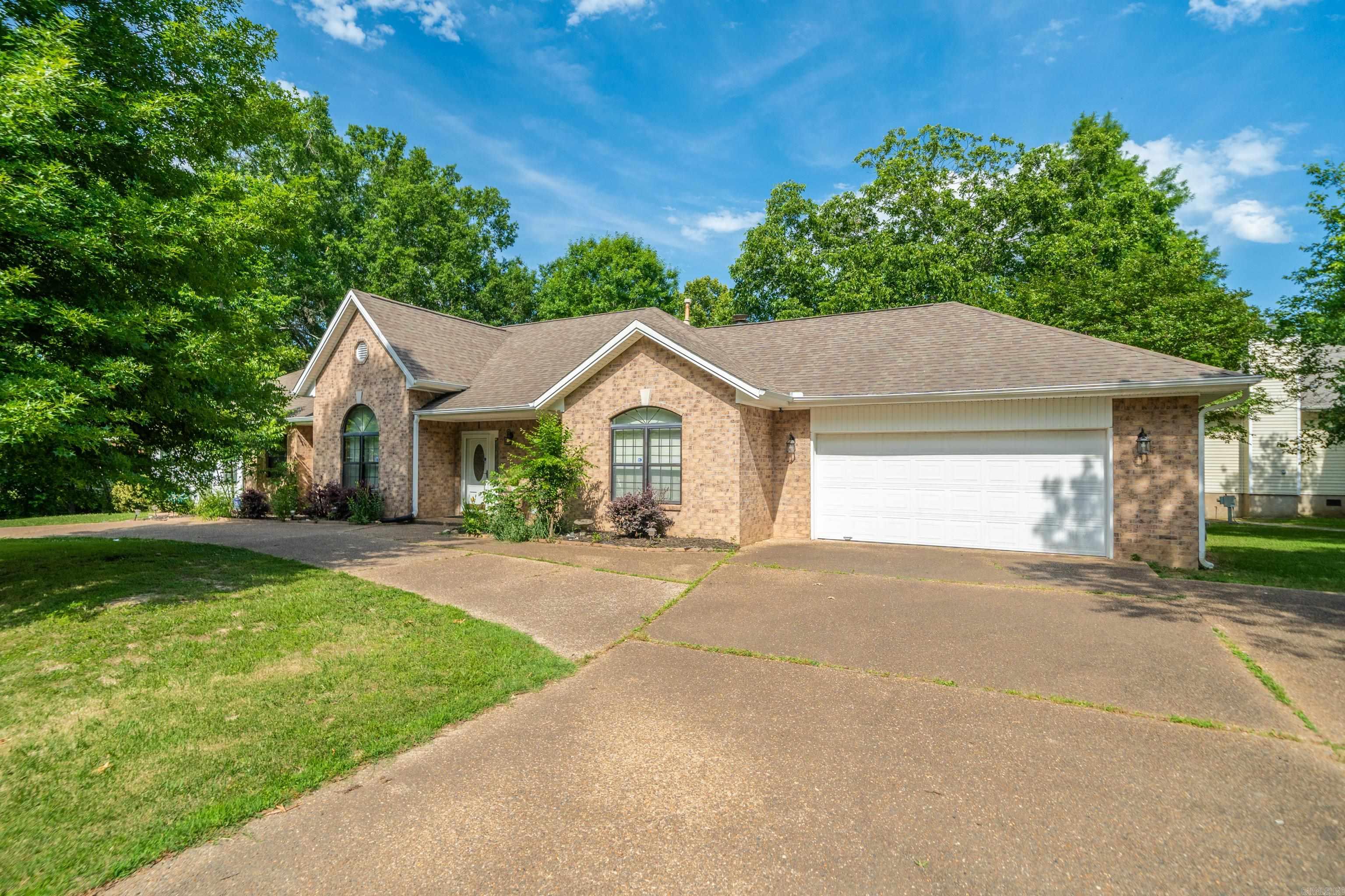 Located on Lake Hamilton, this versatile waterfront property offers a unique opportunity for a variety of uses. The main home features three bedrooms, two bathrooms, a breakfast area, and a separate dining room, providing functional space for everyday living and entertaining. An additional two-bedroom, one-bath living area includes its own full kitchen and living room, offering flexibility for rental income, extended occupancy, or other permitted uses. This setup provides potential for supplemental income or expanded living arrangements. A covered single-stall boat dock with lift will convey, providing convenient access to Lake Hamilton. Situated just off Hwy 7 South, the property offers easy access to shopping, dining, entertainment, and other area amenities while enjoying a waterfront setting on Lake Hamilton.