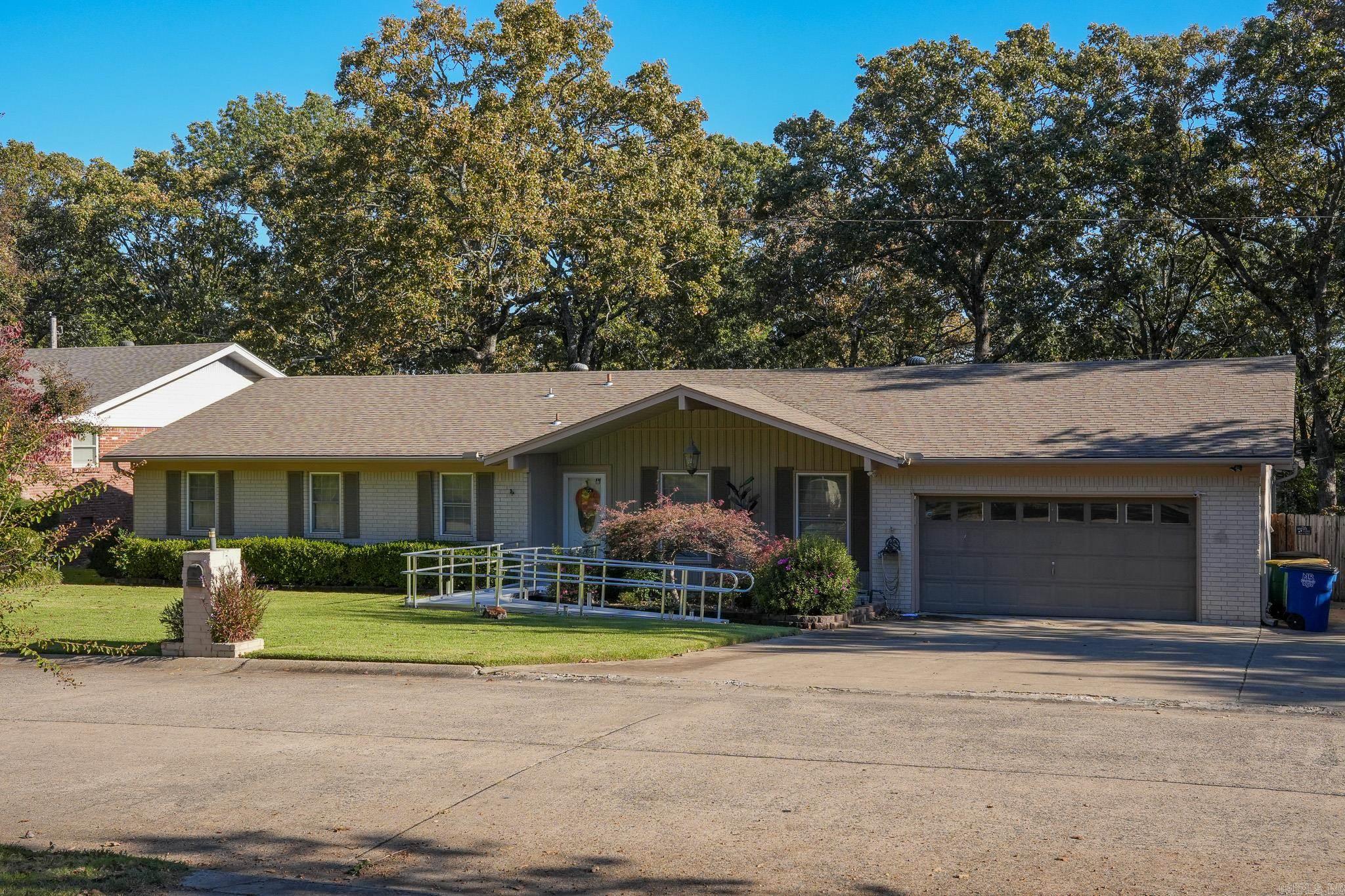 Spacious 4-bedroom, 2-bath home located in the desirable Lakewood neighborhood of North Little Rock. Offering over 2,600 sq ft of living space, this property features multiple living areas filled with natural light and a functional layout ideal for everyday living or entertaining. Built in 1970 and situated on nearly 0.4 acres, the home includes mature landscaping, ample yard space, and great potential for updates or personalization. Conveniently located near schools, shopping, dining, and Lakewood parks, this property combines space, location, and long-term value. A solid opportunity in one of North Little Rock’s most established communities. Roof Replaced 2015