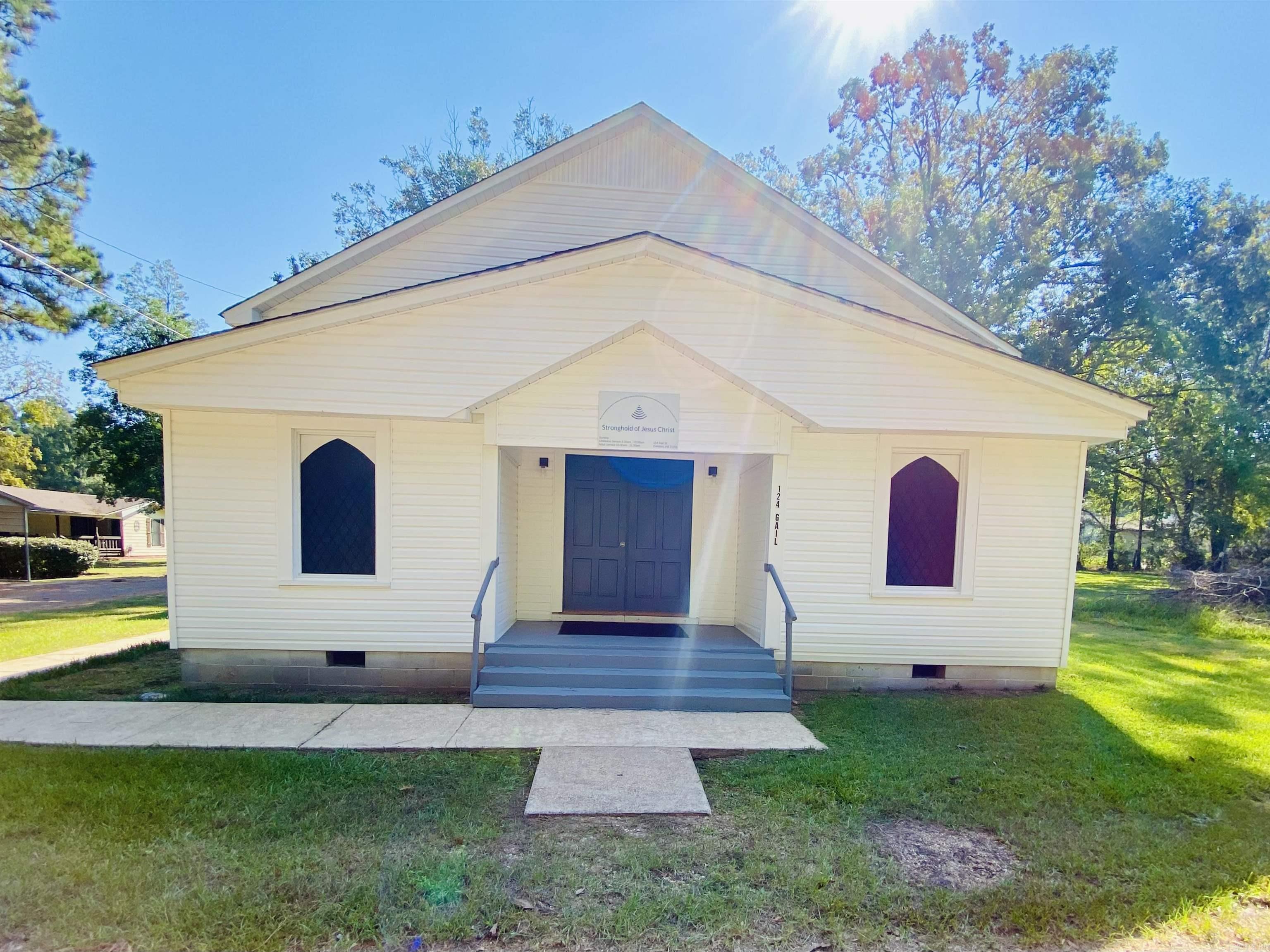 Charming historic church for sale! Step back in time with this beautifully remodeled white church, filled with warmth & character. Nestled on a corner lot, this small traditional sanctuary features original wooden pews, nostalgic stained-glass windows, & a welcoming fellowship hall. Two Sunday school rooms with a baptistry make it fully functional. The entire property has been lovingly updated while preserving its timeless charm. You’ll feel the sweet spirit from the moment you walk through the doors. *New roof, flooring, baptismal, plumbing, gas line, updated bathroom, fresh paint, & on-demand hot water heater. Lot size, square footage, & acreage taken from courthouse records.