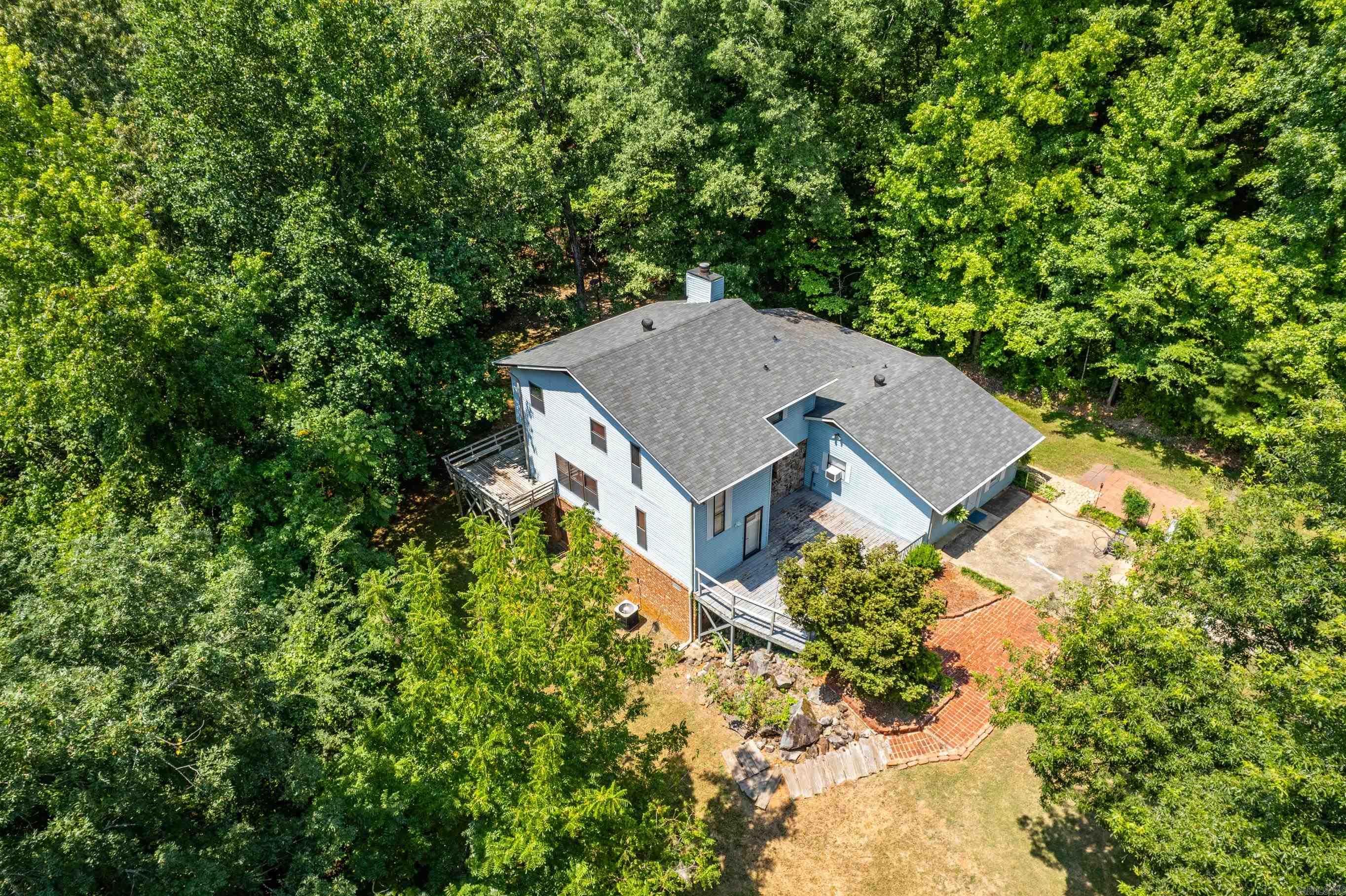 MAGNET COVE lovingly maintained home is situated on more than 4 acres with a detached oversized garage than has endless possibilities. The kitchen is HUGE and can be perfect for entertaining and family events.  A Sellers have records of regular maintenance of heat and air conditioning as well as septic system.  This 3 bedroom, 2 1/2 bath home offers privacy, nature, and peace and a school district that is in high demand. .