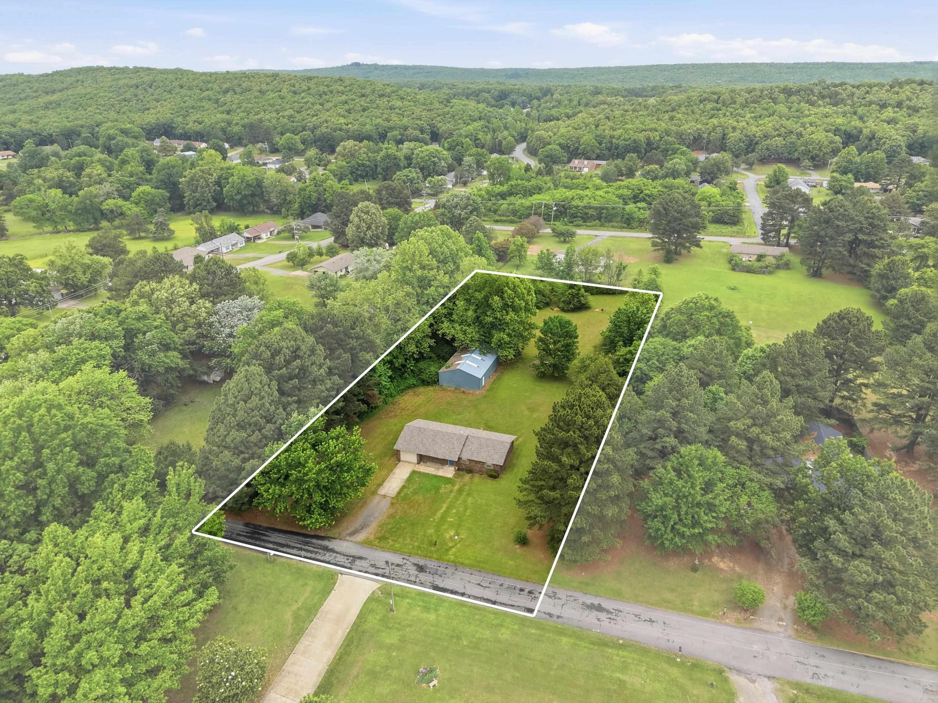 A rare opportunity available in this recently remodeled home on 1.5 acres with a huge shop.  Don't miss out. This home looks and feels like new including a new roof and windows. Granite counter tops in the kitchen with brand new cabinets and appliances. Large laundry room and additional storage room in the garage. The la cerise sur le gâteau is the enormous shop featuring side roller door for ease of cars or tractors getting in or out and its own single door interest. Ready to create your own hobby shop. The size and design of this lot adds an entirely extra dimension to this rare find.  The back acreage has been surveyed and perc'd to be able to build another home if someone desired. These opportunities rarely come around. Survey and Perc test on file. Beautiful home. Call for your tour. We love working with Buyer Agents.