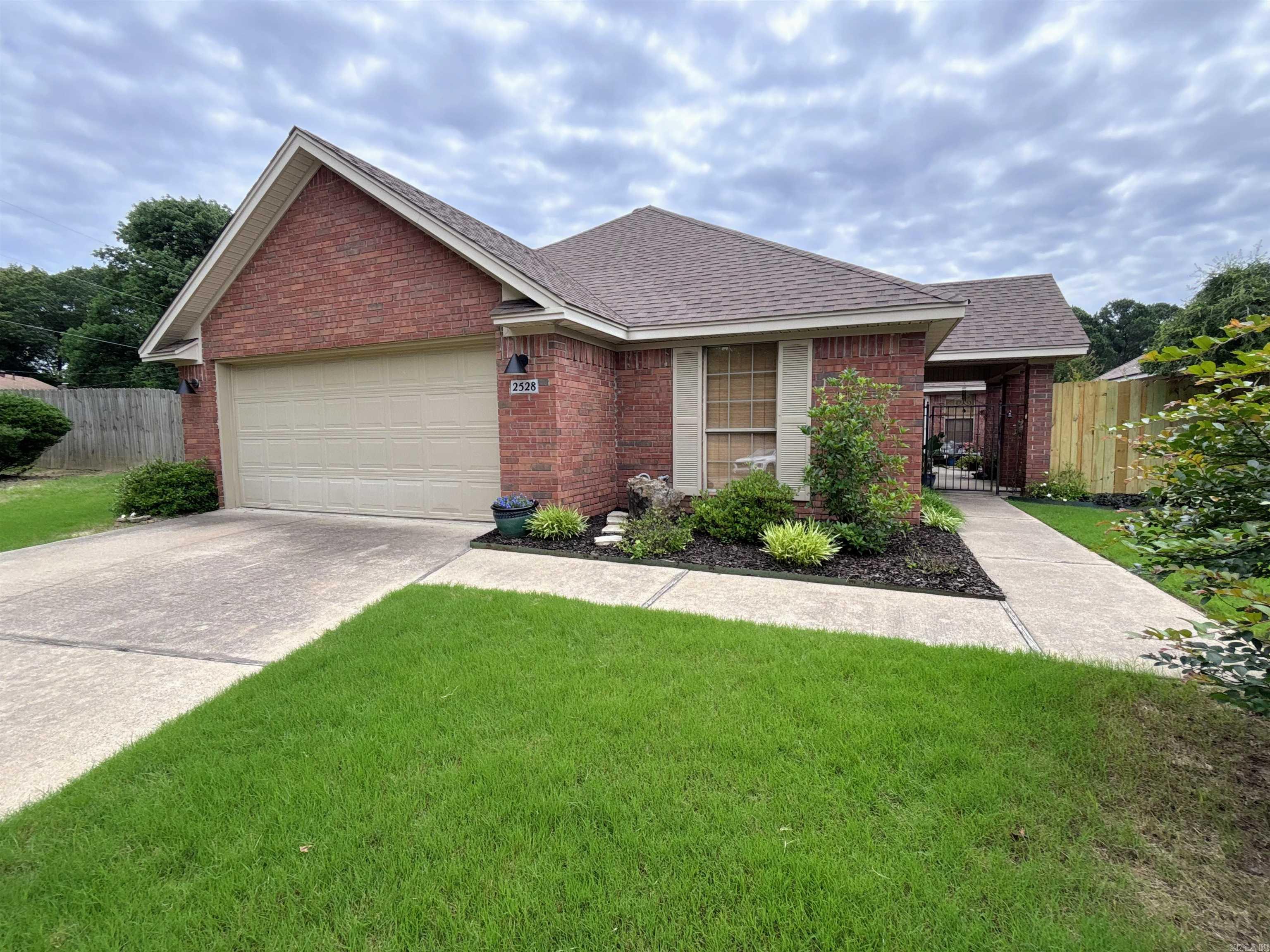 Absolutely Gorgeous 2BR, 2Ba Garden Home with bonus room for studio or office, in quiet, serene Northshore Gardens Subdivision in Benton. Well maintained beautiful, warm, inside & out. Features galore. Open Spaces in living room, kitchen with CUSTOM WINDOW TREATMENTS throughout. You want storage? You'll be set with the many convenient closets throughout this home. Includes two parcels making a large fenced backyard for playing, entertaining, and pets. The extra adjacent parcel circles around the end of the cul-de-sac providing a very spacious feel. Inside, you'll see many recent updates including New Roof, New HVAC, New Garage Motor, New built -in Microwave all at the end of 2025. New fencing 2026. Other recent updates include Irrigation System, Added Deck in back, Updated, more open kitchen with Sliding Door, Updated Cabinets, New Flooring, New Paint & All New Light Fixtures, ceiling fans. Priced to SELL!  More Pictures /video coming soon. Realtors....Please allow 1 hour notice to schedule showing.