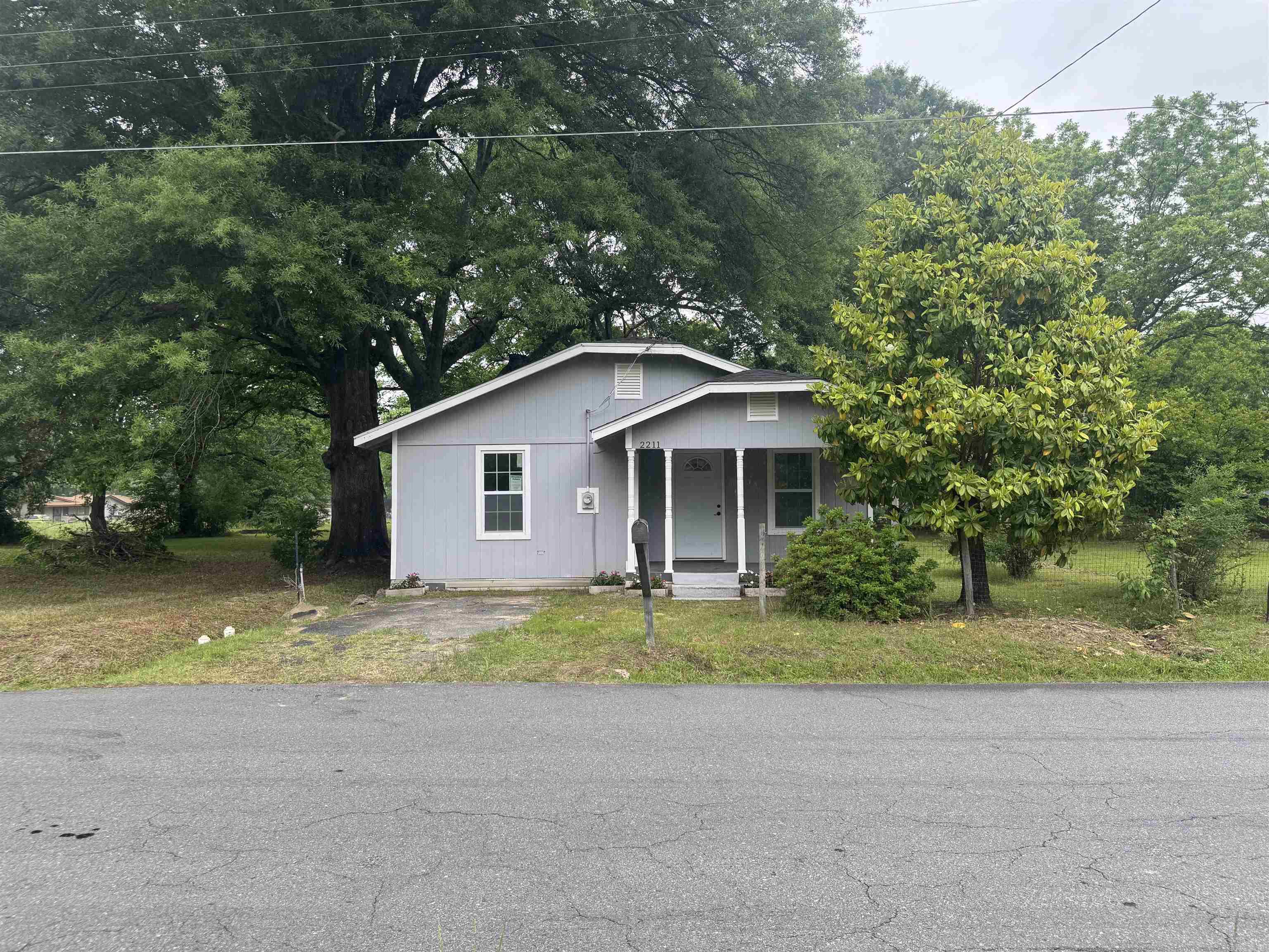 Totally remodeled home featuring washer and dryer hookups, stove, refrigerator, central heat and air, ceiling fans, and abundant natural light throughout. Enjoy relaxing on the porch while sitting on two spacious lots. Perfect opportunity for first-time home buyers — move-in ready and full of charm!