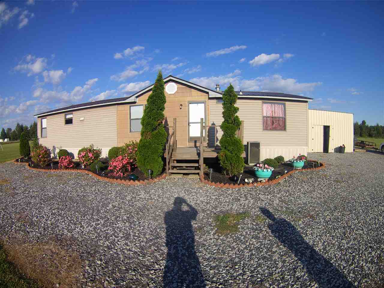 Older but very neat and well kept mobile home.  Small shop. Sitting on 5 beautiful acres.  Really a lot of home for the money.   Lets take a look!