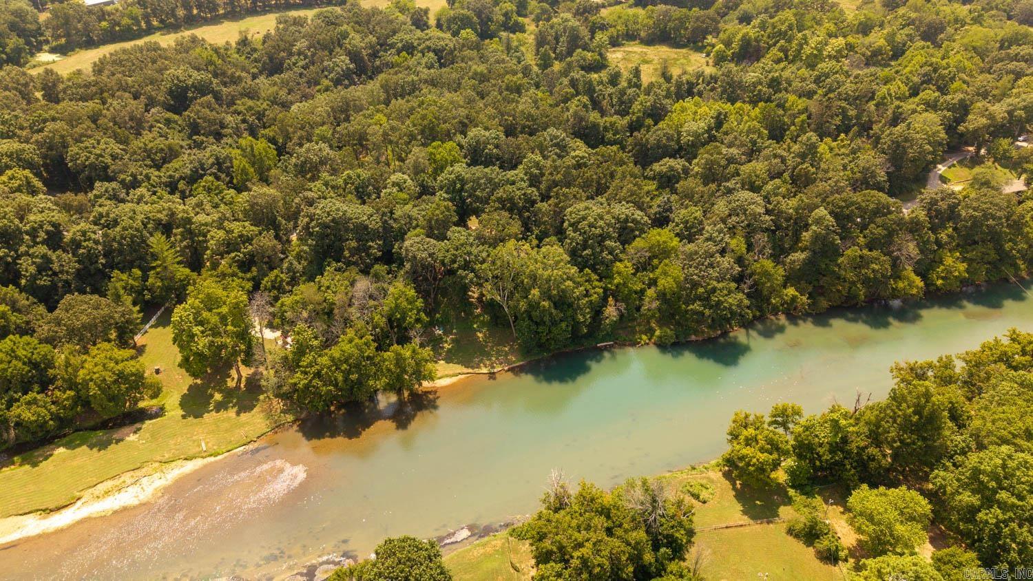 Land For Sale Near the Spring River This 2.04 acre property offers an incredible location with both city water and electricity available, making it an ideal site for your dream home, weekend getaway, or investment property. Situated less than a mile from a public access point on the Spring River, you’ll enjoy easy access to some of the best trout fishing in the region, along with kayaking, floating, and year-round outdoor fun. Just one mile from Mammoth Spring State Park, you’ll be close to one of the largest natural springs in the U.S., featuring walking trails, historic sites, and family-friendly recreation. The property is a blank canvas that is ideal to build your primary residence or a river lifestyle getaway! The charming town of Mammoth Spring provides local dining, shops, and conveniences, while the surrounding Ozarks offer endless opportunities for exploring nature. With utilities nearby and a prime location, this property is perfect for those who love the outdoors but want the convenience of town and highway access close at hand.