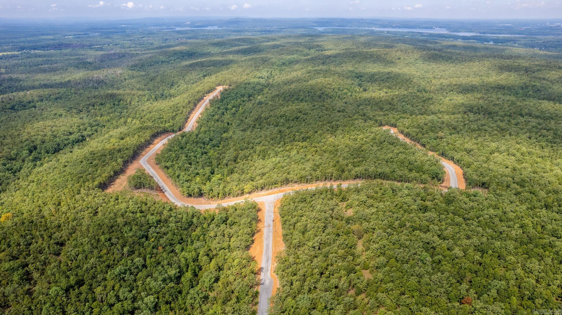 Scenic land is available in the desirable Doris Heights Subdivision, offering the perfect setting to build your custom home. This subdivision features paved roads throughout and a 2,000 sq ft minimum build requirement, ensuring quality and consistency throughout the neighborhood. Perfectly located between Little Rock, Conway, and Cabot, this property provides convenient access to multiple city centers while maintaining a peaceful, country feel. Enjoy beautiful views of rolling hills, creating an ideal backdrop for your future home and outdoor living spaces. (Utilities are available at the road - agents see remarks.)  Whether you’re looking to build now or invest for the future, this property offers location, views, and build standards that make it a standout opportunity.