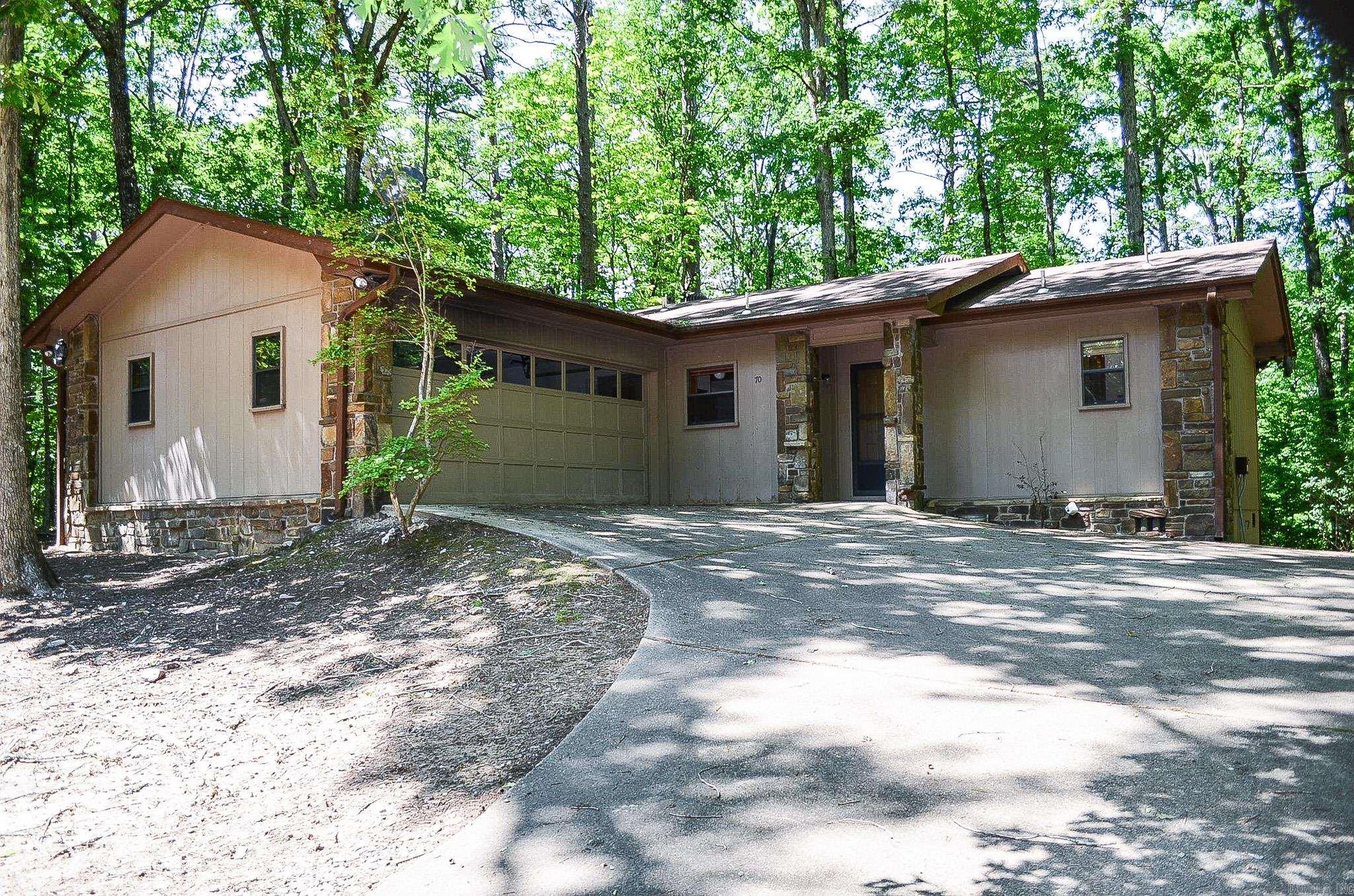Popular "Villager 2" Cooper floor plan...With a few updates and your special touches this home will be a comfortable spot to call your own. The property features laminate flooring, double garage and private deck adjoining common property woods. The open floor plan highlights split bedrooms and 2 full baths. Kitchen houses pantry and washer/dryer closets. Located close to Lake Cortez. No seller property disclosure is available. Hot Springs Village Property Owner Association has a new member buy-in fee of $2,000.00 due and collected at closing.