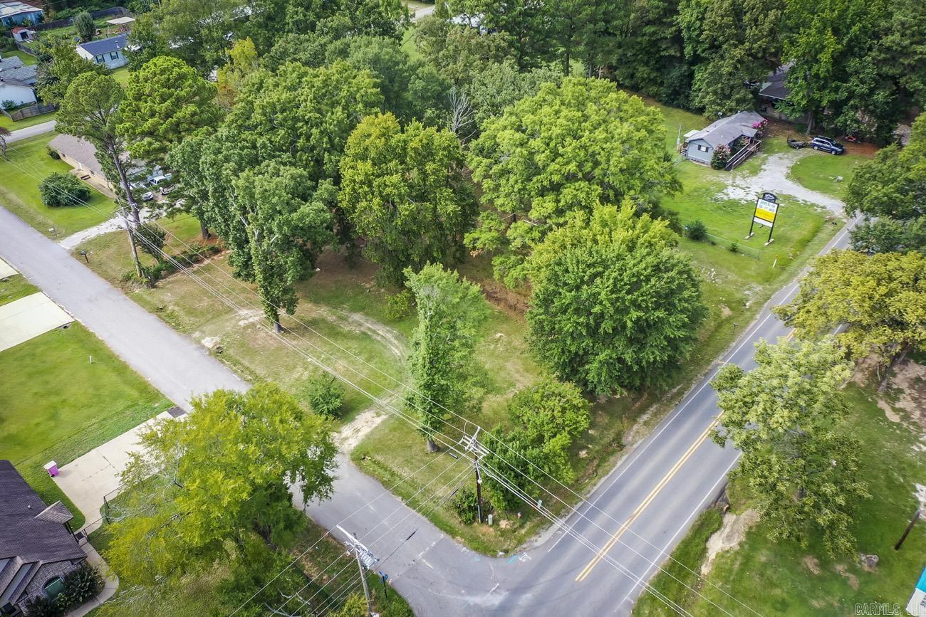 Conveniently located on a high-traffic roadway, this commercial lot offers outstanding visibility and exposure for your future business. Zoned C-2, the property is suitable for a wide variety of commercial uses, making it an excellent investment opportunity. Whether you’re considering a bakery, coffee shop, retail store, boutique, office space, medical or professional services, daycare, salon, auto-related business, convenience store, or mixed commercial development, the possibilities are extensive. Existing trees provide flexibility, keep them for natural beauty and shade or clear the site to maximize your development plans. If you’ve been searching for a location with strong traffic counts and exceptional potential, this property deserves a closer look. Total lot is 0.69-acre. To be sold with MLS 26021762