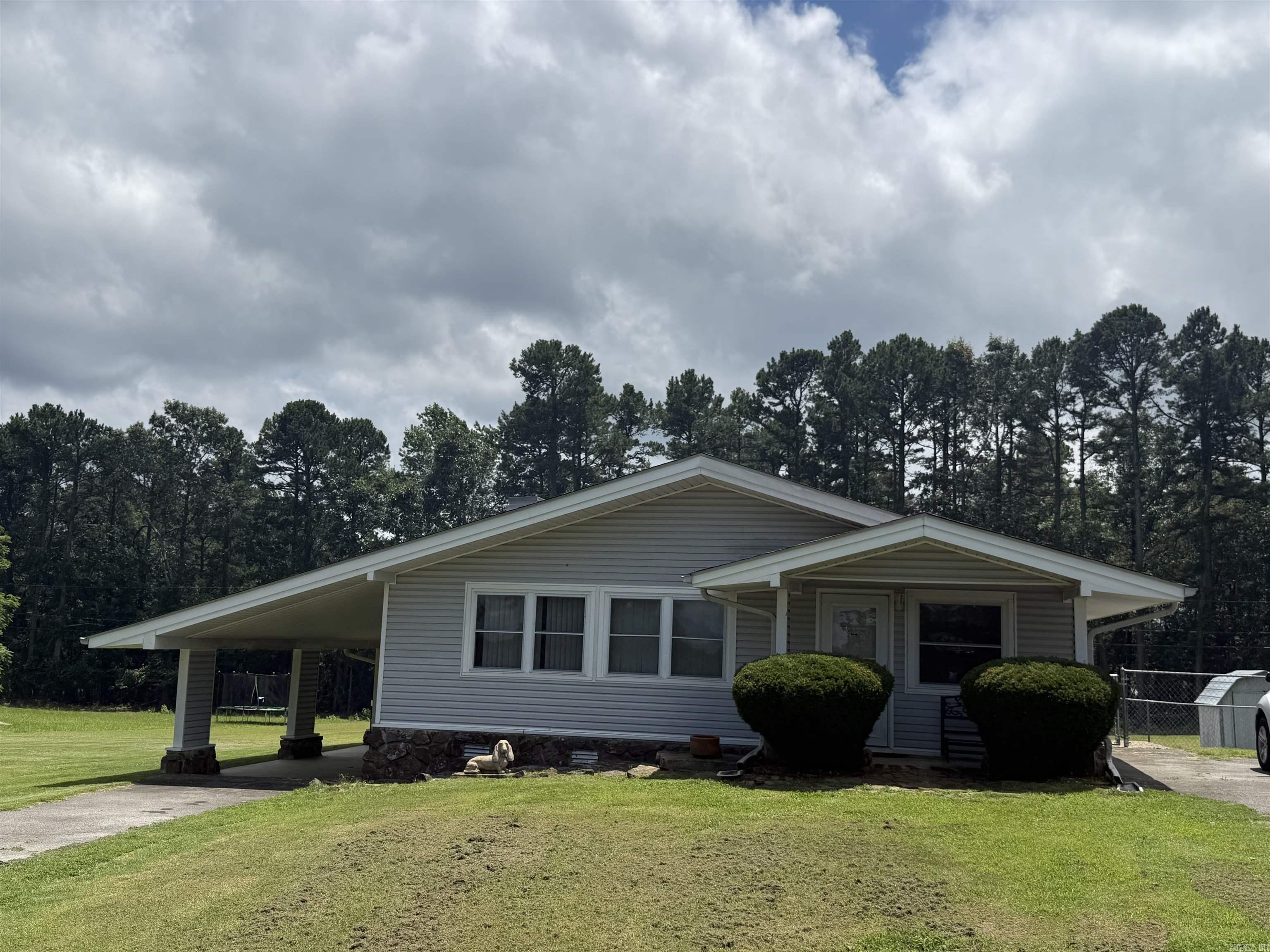 Welcome home to peaceful country living just minutes from Heber Springs! Situated on approximately 0.9 acres, this charming 3-bedroom, 2-bathroom home offers the perfect blend of space, comfort, and convenience. Step inside to an inviting open-concept layout where the living room, kitchen, and dining area flow seamlessly together, creating a warm and welcoming space for everyday living and entertaining. Outside, you’ll find plenty of room to enjoy the outdoors, whether you’re gardening, playing, or simply relaxing. The partially fenced side yard provides a great space for pets, children, or additional privacy. With a desirable location just outside of town, you’ll enjoy a quiet setting while still being close to shopping, dining, schools, and all that Heber Springs has to offer. Don’t miss your opportunity to own this beautiful property with room to spread out and enjoy country living at its best.
