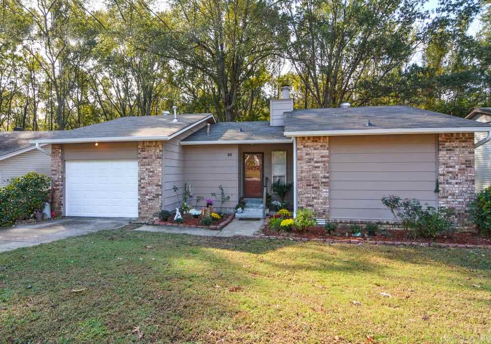 This home is too special to miss! Open living/dining are features beautiful hardwoods & cozy warmth while sitting in front of your gas FP w/decorative brick wall. Add'l living space in the bright cheery sunroom w/a wall of windows & unique vaulted/paneled ceiling. An efficient kitchen provides all the home cook needs. The master is tucked away providing peace & quiet. Enjoy the great outdoors on the 2 tier deck overlooking a wooded vista. See agent remarks for updates.