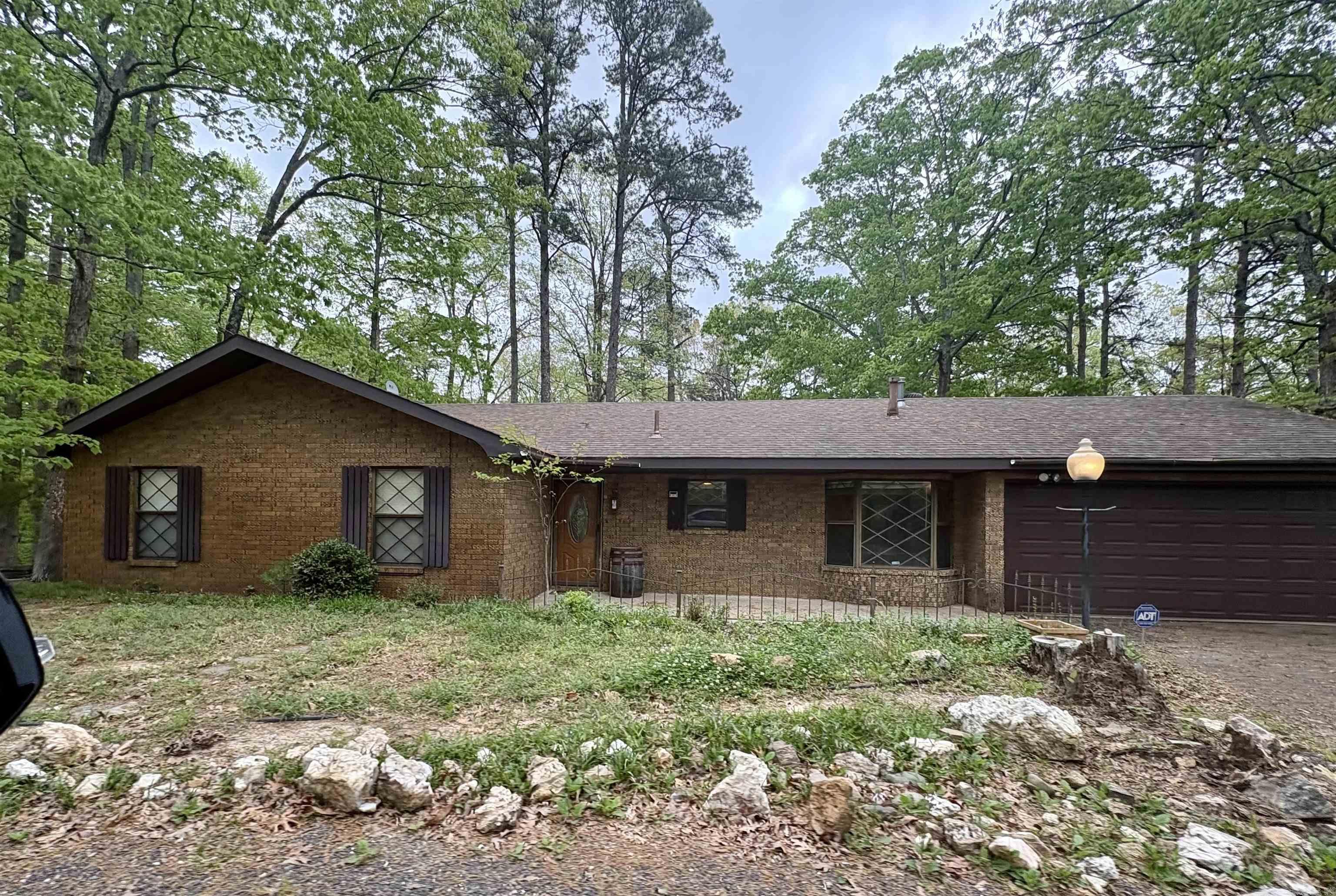 Check out this 3/2 brick home tucked back into a beautiful 6.27 acre property! With a peaceful rustic feel, you still have the availability to make it your own. The living room has new floors, beautiful vaulted ceilings, sliding doors leading to the large back deck, and a door leading to the spacious sunroom which also leads to the craftroom. There are FOUR buildings outside for ample amount of extra storage. Don't miss this opportunity to be on acreage right outside the city. *** Agents See Remarks ***